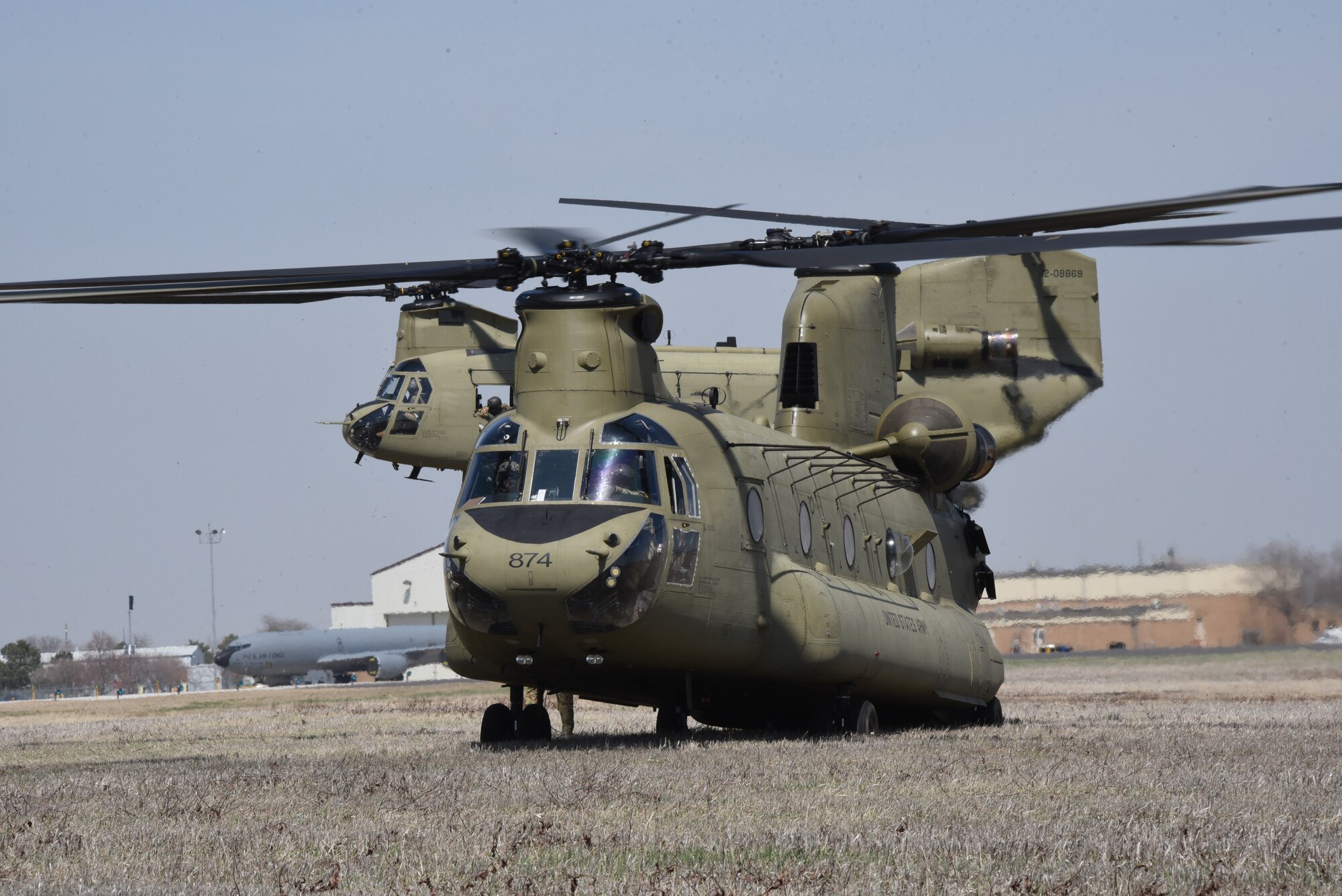 Iowa Army National Guard CH-47 Chinook helicopter picks up a F-80 fighter jet at the Air National Guard paint facility