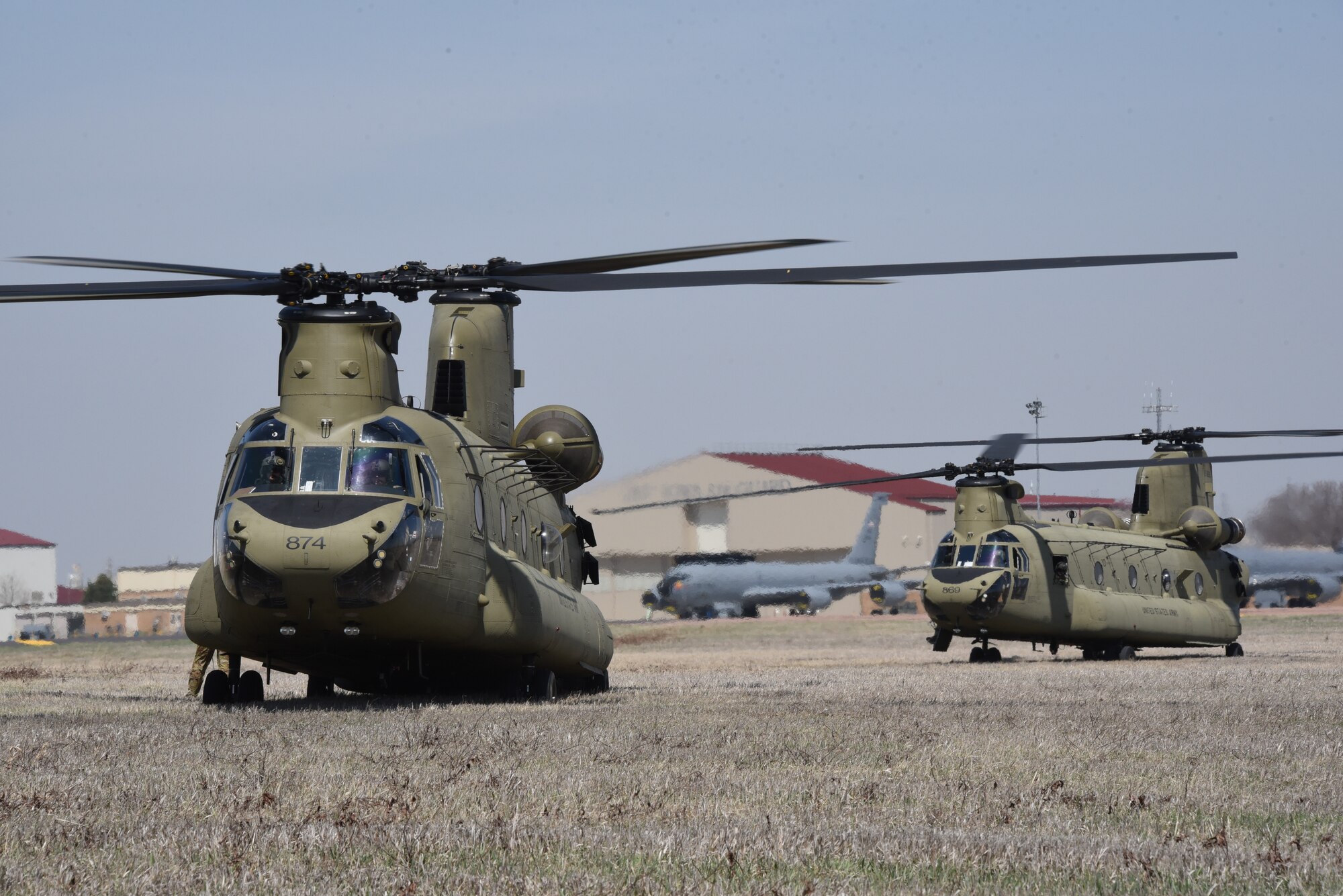 Iowa Army National Guard CH-47 Chinook helicopter picks up a F-80 fighter jet at the Air National Guard paint facility