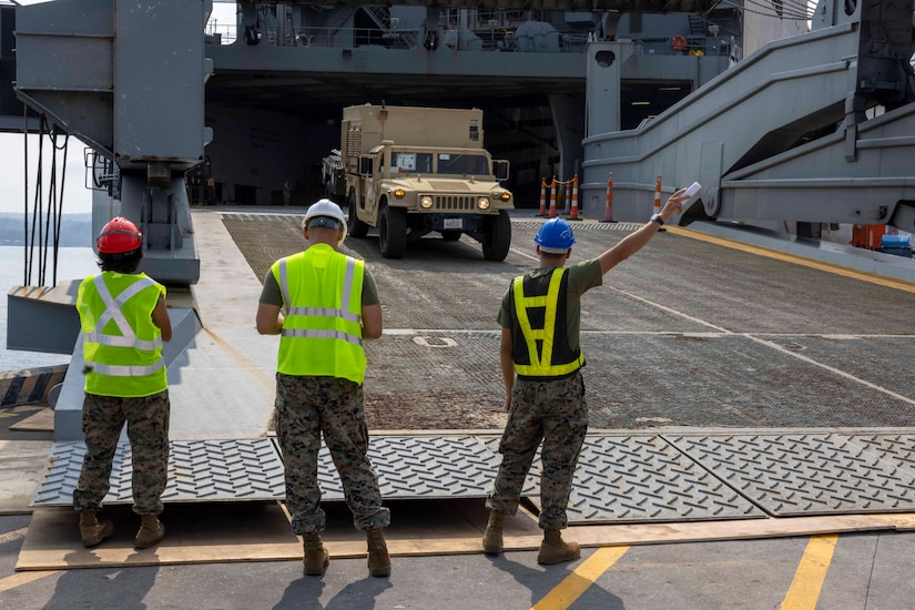 Vehicle is offloaded from ship.