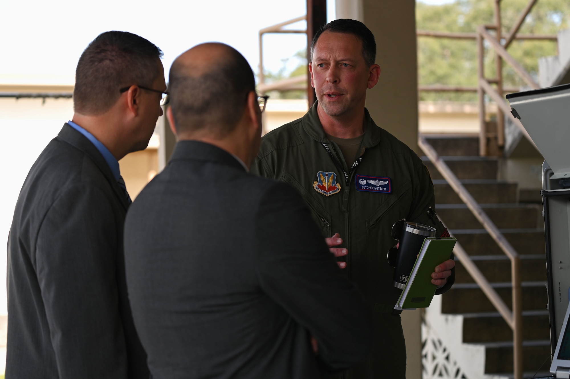 U.S. Air Force Lt. Col. Thomas E. Metzger, 87th Electronic Warfare Squadron commander, briefs John F. Vona, Air Combat Command deputy director of the plans, program and requirements directorate, right, and Dr. John D. Matyjas, ACC chief scientist, left, pose for a photo at Eglin Air Force Base, Fla., April 11, 2023. The 87th EWS is responsible for all aspects of Air Force's lead Electronic Warfare Assessment Program COMBAT SHIELD. (U.S. Air Force photo by Staff Sgt. Ericka A. Woolever)