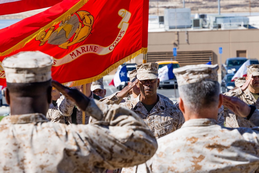 US Marine Corps Sergeant Major salutes a USMC Sergeant Major and a USMC Colonel