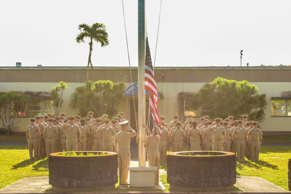 NAVAL BASE GUAM (April 1, 2023) - Chief Petty Officers (CPO) from U.S. Naval Base Guam and various tenant commands salute for colors in honor of 130 years of the CPO, at the NBG Headquarters April 1.