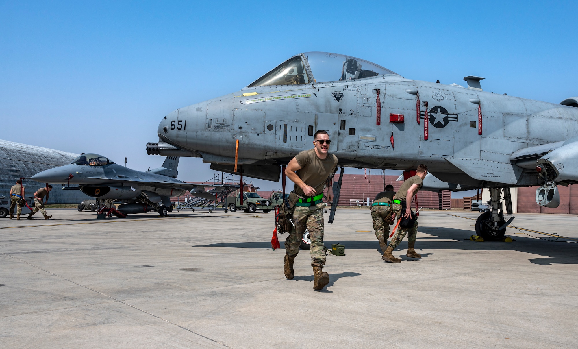 U.S. Air Force weapons load crew members from the 25th and 36th Fighter Generation Squadrons, participate in a weapons load crew of the quarter competition at Osan Air Base, Republic of Korea, March 31, 2023.
