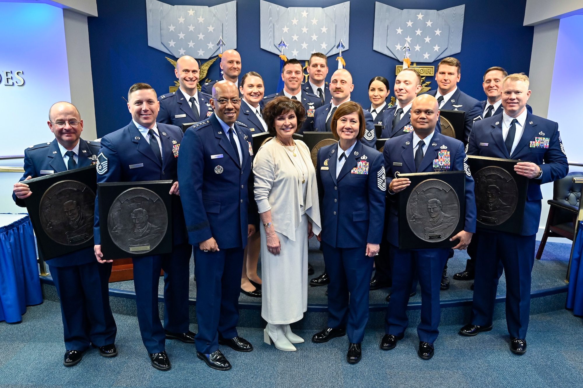 Air Force Chief of Staff Gen. CQ Brown, Jr., third from left, and Chief Master Sgt. of the Air Force JoAnne S. Bass, fifth from left, pose with Janine Sijan, center, and recipients of the 2019 to 2022 Lance P. Sijan USAF Leadership Awards during a ceremony at the Pentagon, Arlington, Va., April 3, 2023. The award is named for Medal of Honor recipient Capt. Lance Sijan, who died while being held as a prisoner of war during the Vietnam War. (U.S. Air Force photo by Eric Dietrich)