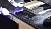 Forensic Scientist examining shoeprint evidence in the lab