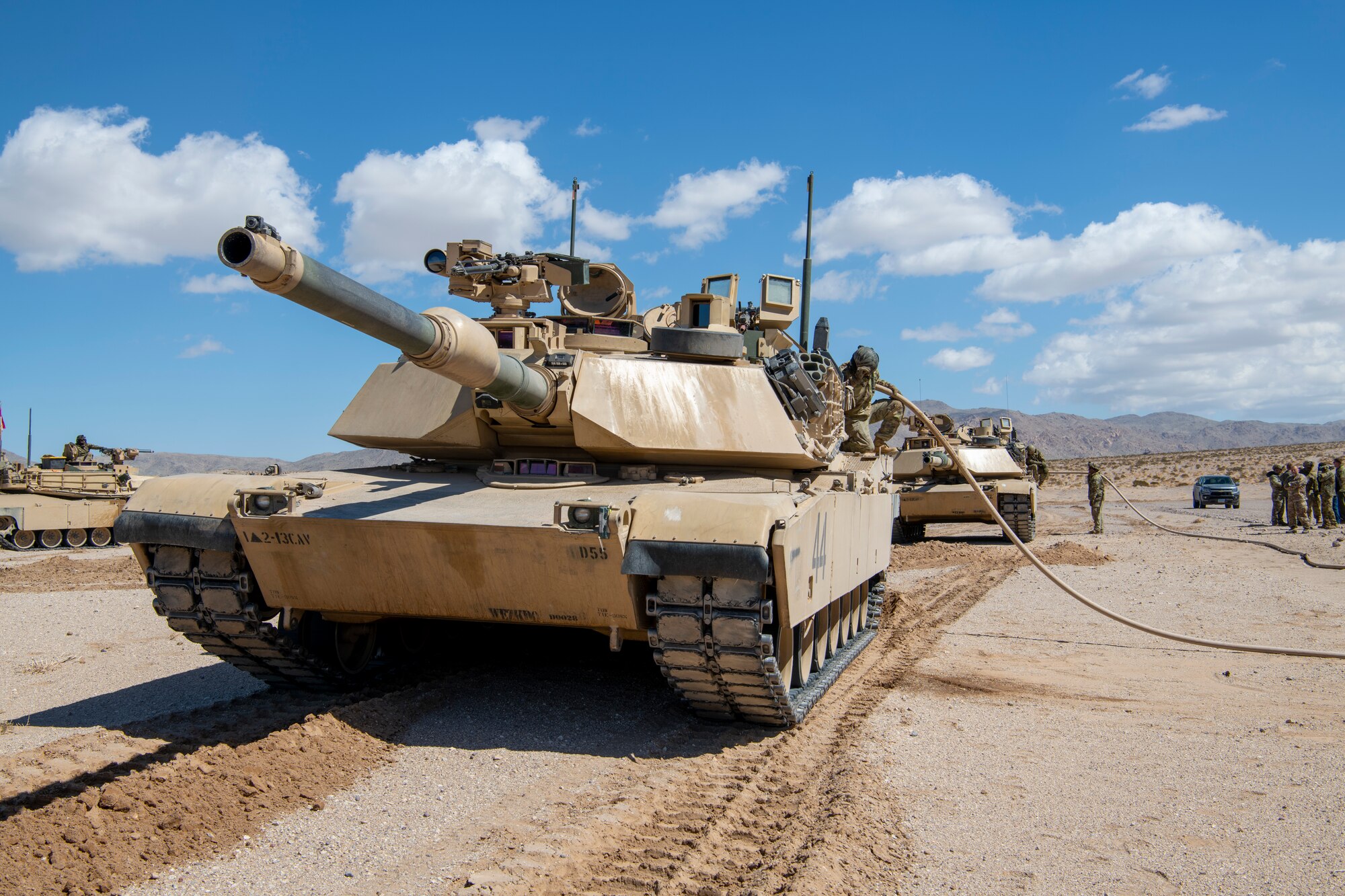 A1M2 Abrams tanks get refueled from a C-130J Super Hercules in the California desert during Operation Night King March 26, 2023.