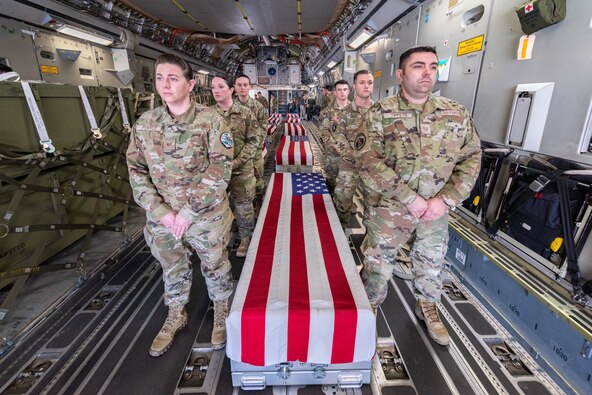 Members from across Team Offutt carry transfer cases containing remains of American World War II servicemembers disinterred from France and Germany during an honorable carry ceremony on April 4, 2023, at Offutt Air Force Base, Neb. This was the first honorable carry ceremony the Defense POW/MIA Accounting Agency has held at Offutt since the runway reopened. “It is humbling to think about the sacrifices these soldiers made, and I am proud to see the effort being made to reunite them with their families” said Rep. Mike Flood, who attended the event along with Nebraska Governor Jim Pillen and other local elected officials and base leadership.(U.S. Air Force photo by Nicholas Harnack).