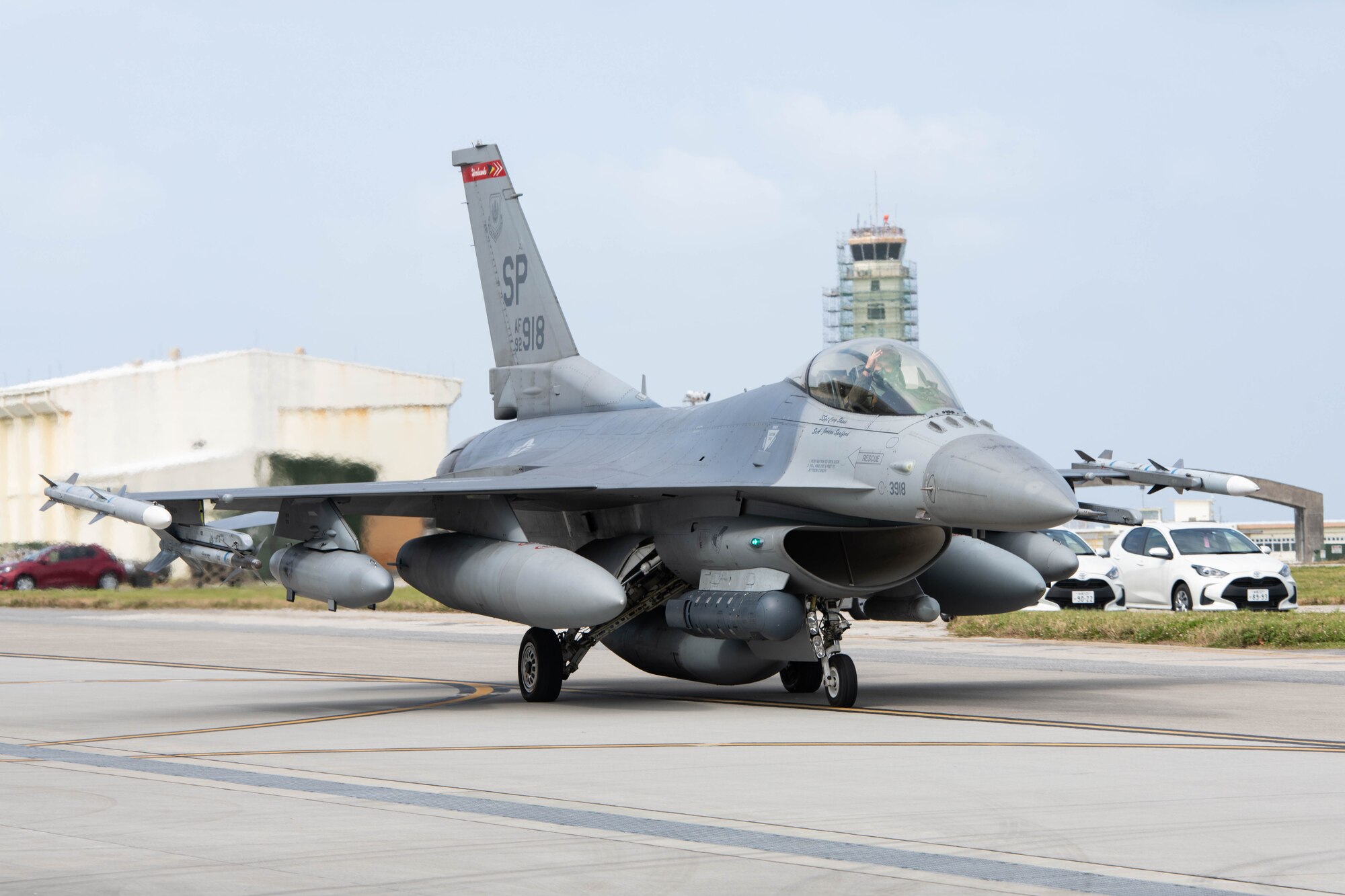 An aircraft taxis down the flightline.