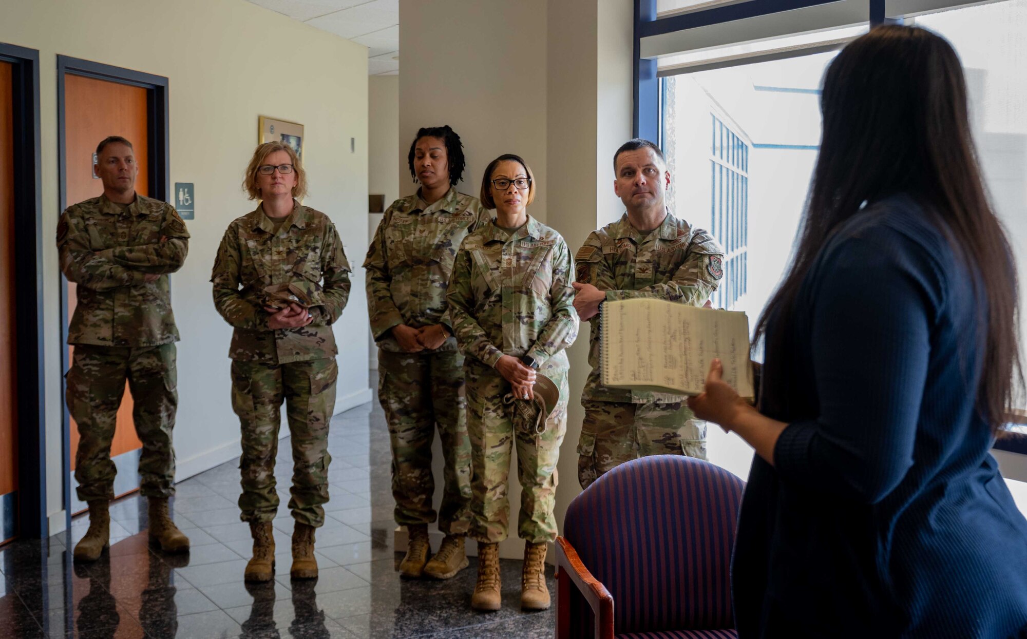 Representatives from the 436th Mission Support Group and the 512th MSG pose for a photo in front of the Delaware Emergency Management Agency Emergency Operations Center in Smyrna, Delaware, April 6, 2023. During the immersion event, DEMA was able to share best practices with Team Dover Airmen regarding preparedness for natural disasters, terrorism response, emergency operations center training, behavior threat analysis for school safety and community engagement. (U.S. Air Force photo by Senior Airman Faith Barron)