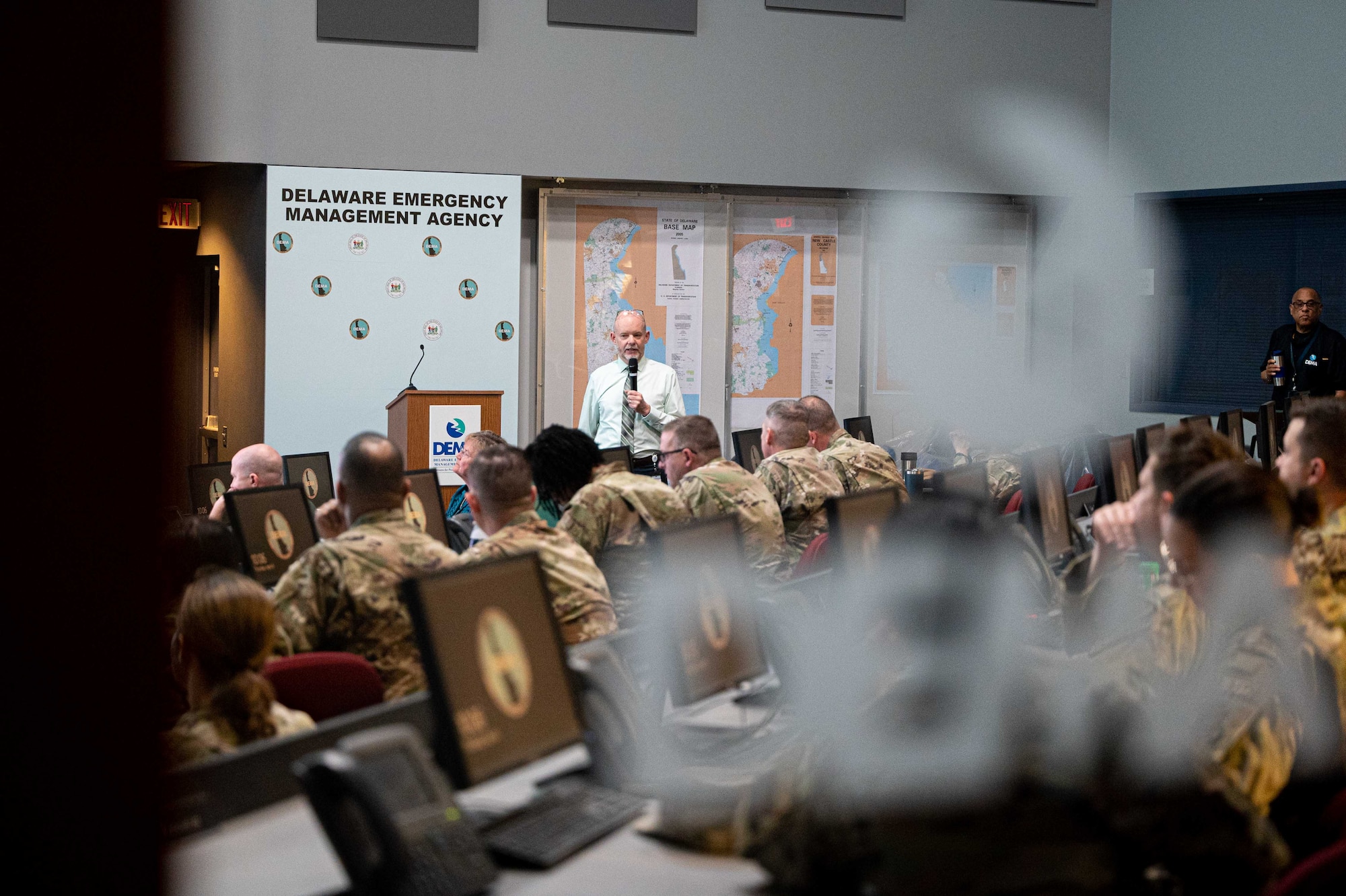 Chris Murtha, Delaware Emergency Management Agency deputy director, briefs representatives from the 436th Mission Support Group and the 512th MSG during an immersion event in Smyrna, Delaware, April 6, 2023. During the event, DEMA was able to share best practices with Team Dover Airmen regarding preparedness for natural disasters, terrorism response, emergency operations center training, behavior threat analysis for school safety and community engagement. (U.S. Air Force photo by Senior Airman Faith Barron)