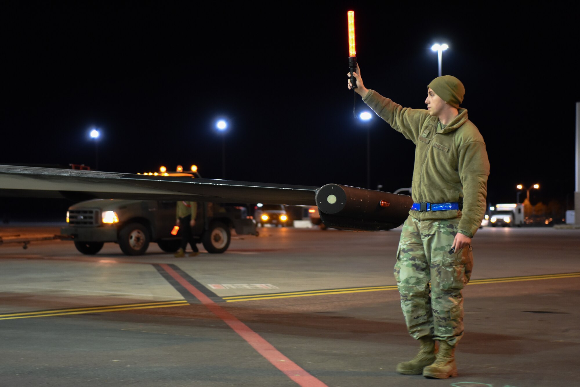 A U.S. Air Force 9th Maintenance Squadron aerospace propulsion journeyman guides a U-2 Dragon Lady into place after an evening sortie in support of Dragon Flag EAST, March 27, 2023, at Offutt Air Force Base, Nebraska.