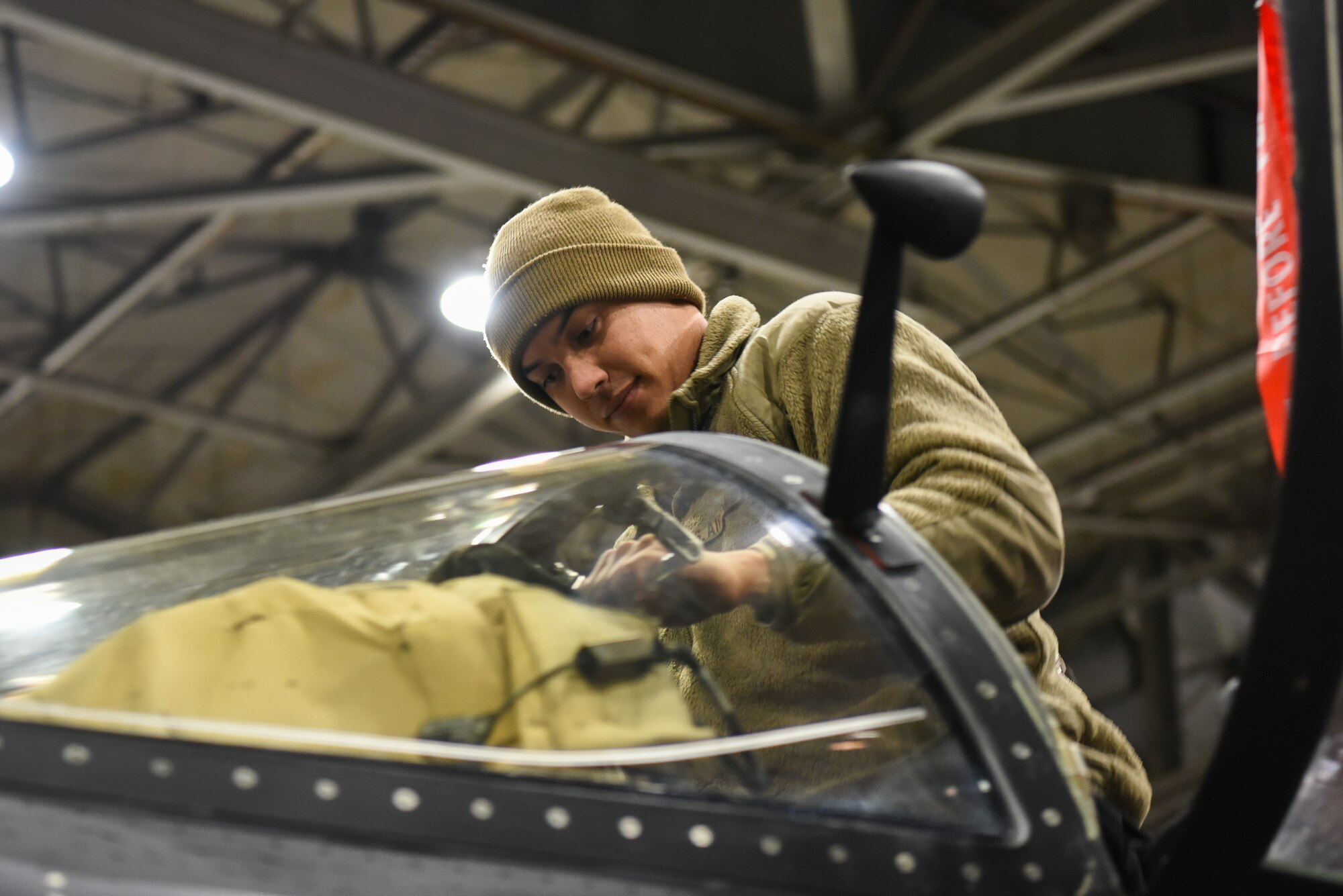 A U.S. Air Force 9th Aircraft Maintenance Squadron dedicated crew chief conducts a canopy inspection on the U-2 Dragon Lady after recovery from a night mission in support of Dragon Flag EAST, March 27, 2023, at Offutt Air Force Base, Nebraska.