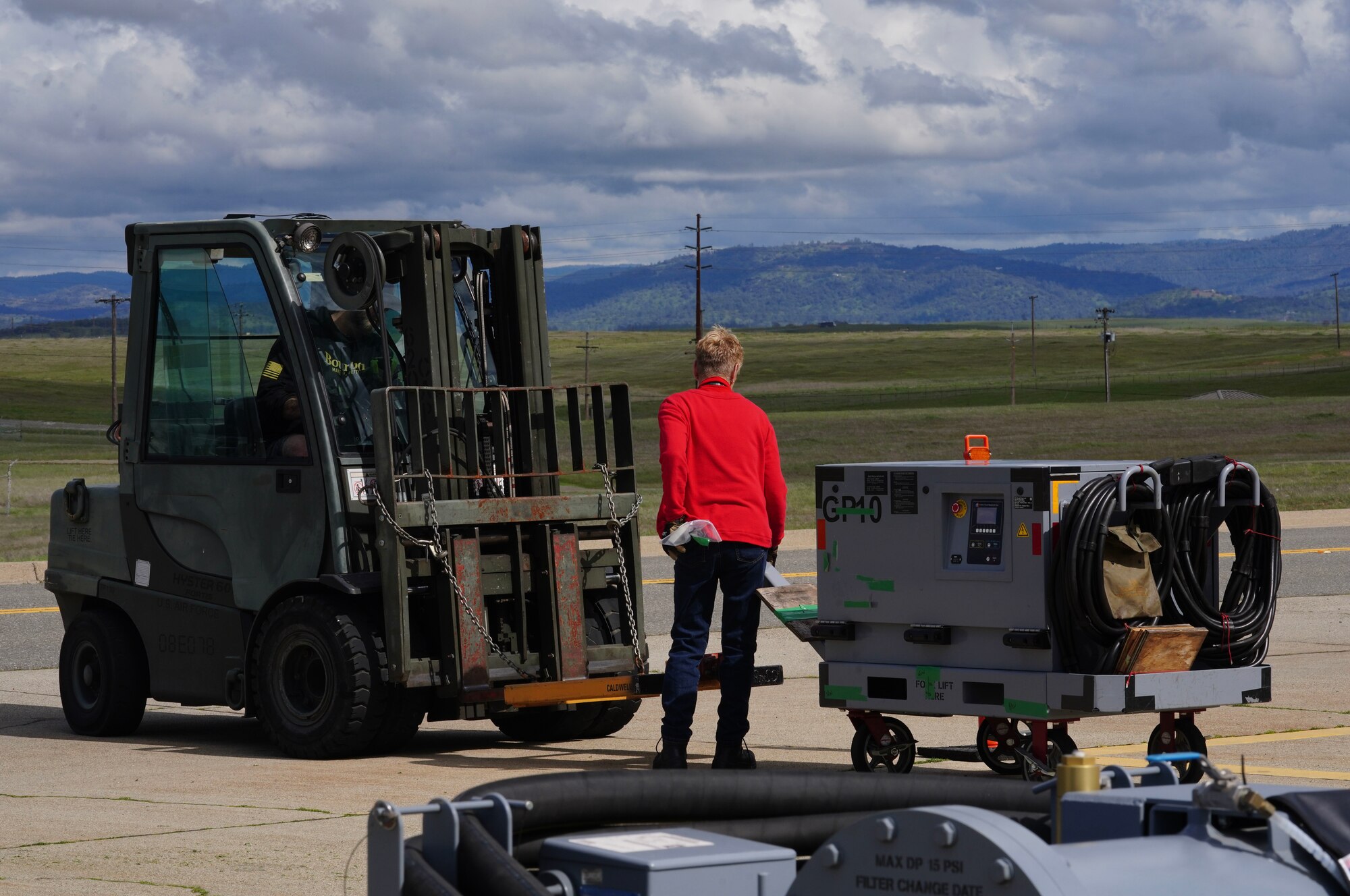 U.S. Air Force 9th Logistics Readiness Squadron training management office personnel haul equipment to be loaded onto trucks, March 20, 2023, at Beale Air Force Base, California.