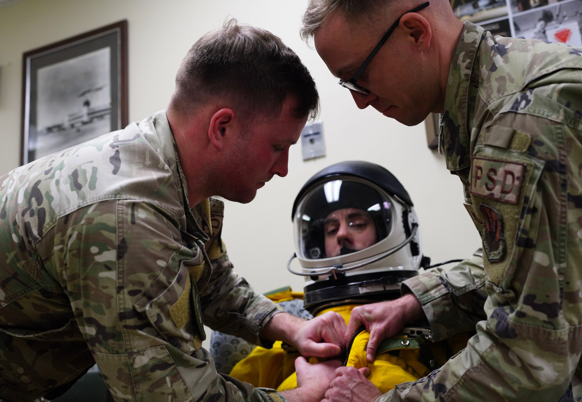 A U.S. Air Force 9th Physiological Support Squadron Airmen secure a pressurized suit on a 99th Reconnaissance Squadron U-2 Dragon Lady pilot April 1, 2023, at Offutt Air Force Base, Nebraska.