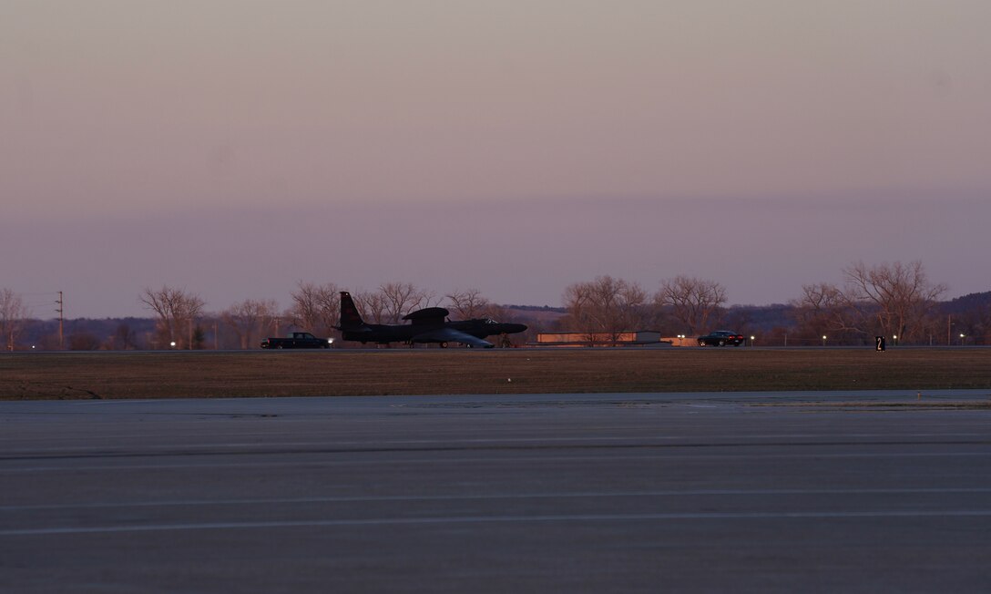 U.S. Air Force 9th Aircraft Maintenance Squadron Airmen place pogos under the wings of a U-2 Dragon Lady, April 1, 2023, at Offutt Air Force Base, Nebraska.