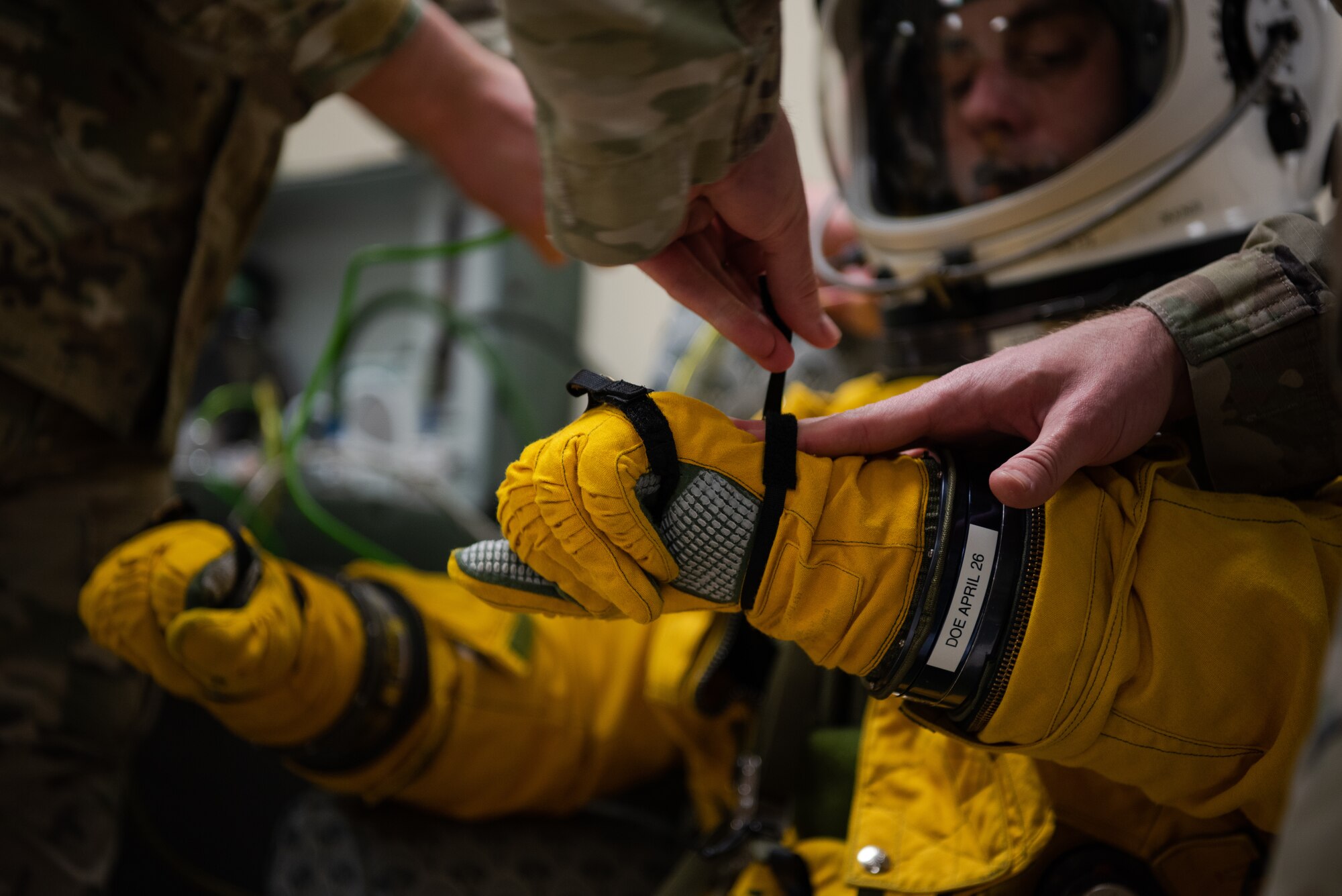 U.S. Air Force 9th Physiological Support Squadron Airmen secure a 99th Reconnaissance Squadron U-2 Dragon Lady pilot’s gloves and suit for a high flight April 1, 2023, at Offutt Air Force Base, Nebraska.