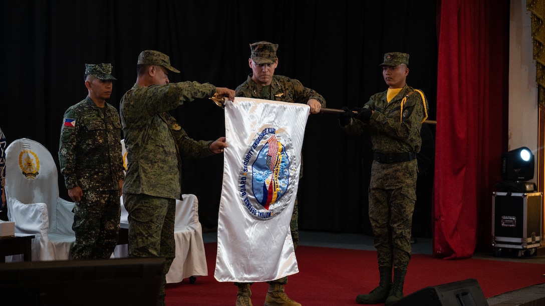 Philippine and U.S. military representatives conduct the unfurling of the flag during the opening ceremony to commence Balikatan 23 at Camp Aguinaldo, Manila, Philippines, April 11, 2023. Balikatan is an annual exercise between the Armed Forces of the Philippines and the U.S. military designed to strengthen bilateral interoperability, improve capabilities, and reinforce the shared security relationship built over decades of training and cooperation. More than 17,600 troops are participating in Balikatan 23, the 38th iteration of the exercise. (U.S. Air Force photo by Staff Sgt. Sadie Colbert)