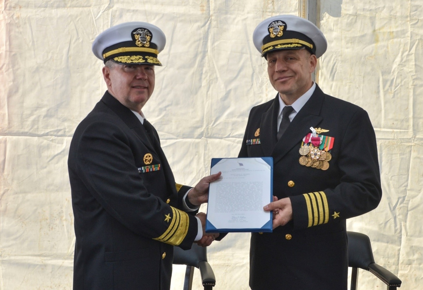 (April 11, 2023) Vice Adm. Thomas Ishee, commander, U.S. Sixth Fleet, presents Capt. Daniel Prochazka, commanding officer of the Blue Ridge-class command and control ship USS Mount Whitney (LCC 20), with an award during the ship’s change of command in Gaeta, Italy, April 11, 2023. Mount Whitney, the U.S. Sixth Fleet flagship, homeported in Gaeta, Italy entered its regularly scheduled overhaul to make improvements in order to increase the security and stability of the U.S. Sixth Fleet area of operations.