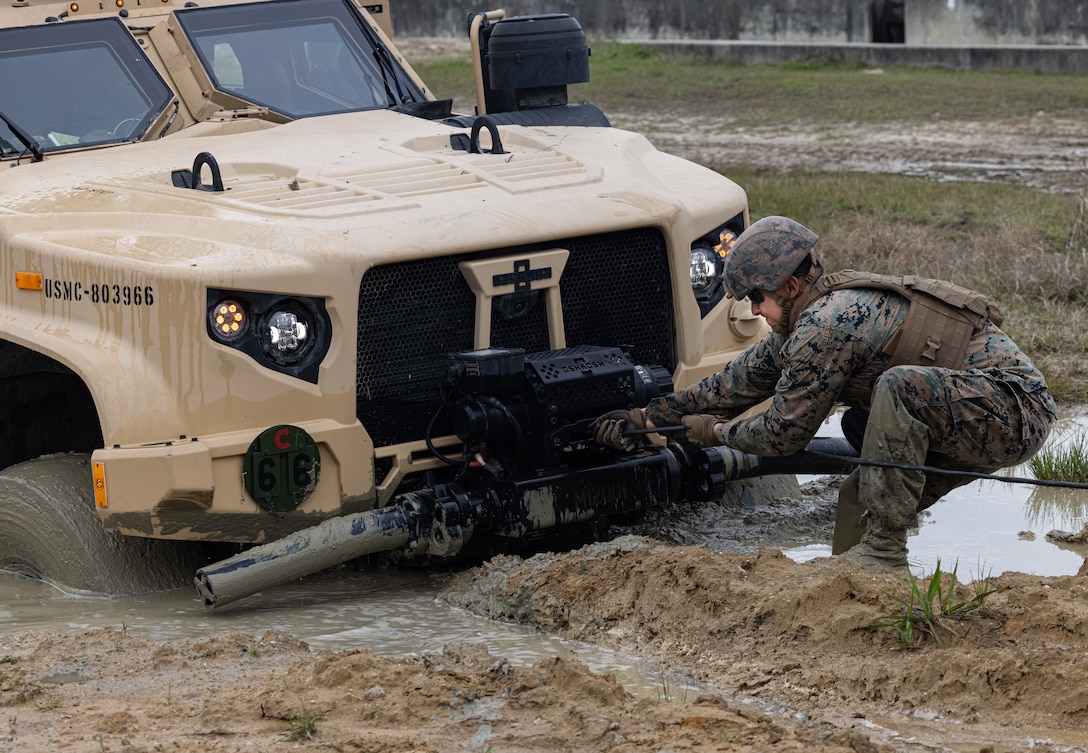 U.S. Marine Corps Cpl. Derek Castellanos, a motor transport operator, with Headquarters Company, 6th Marine Regiment, 2d Marine Division, conducts a recovery operation during the Light Tactical Family (LTF) Crew Maneuver Course on Camp Johnson, North Carolina, April 4, 2023. The five-day course focused on training and educating crew members on effective LTF employment. (U.S. Marine Corps photo by Lance Cpl. Joshua Kumakaw)