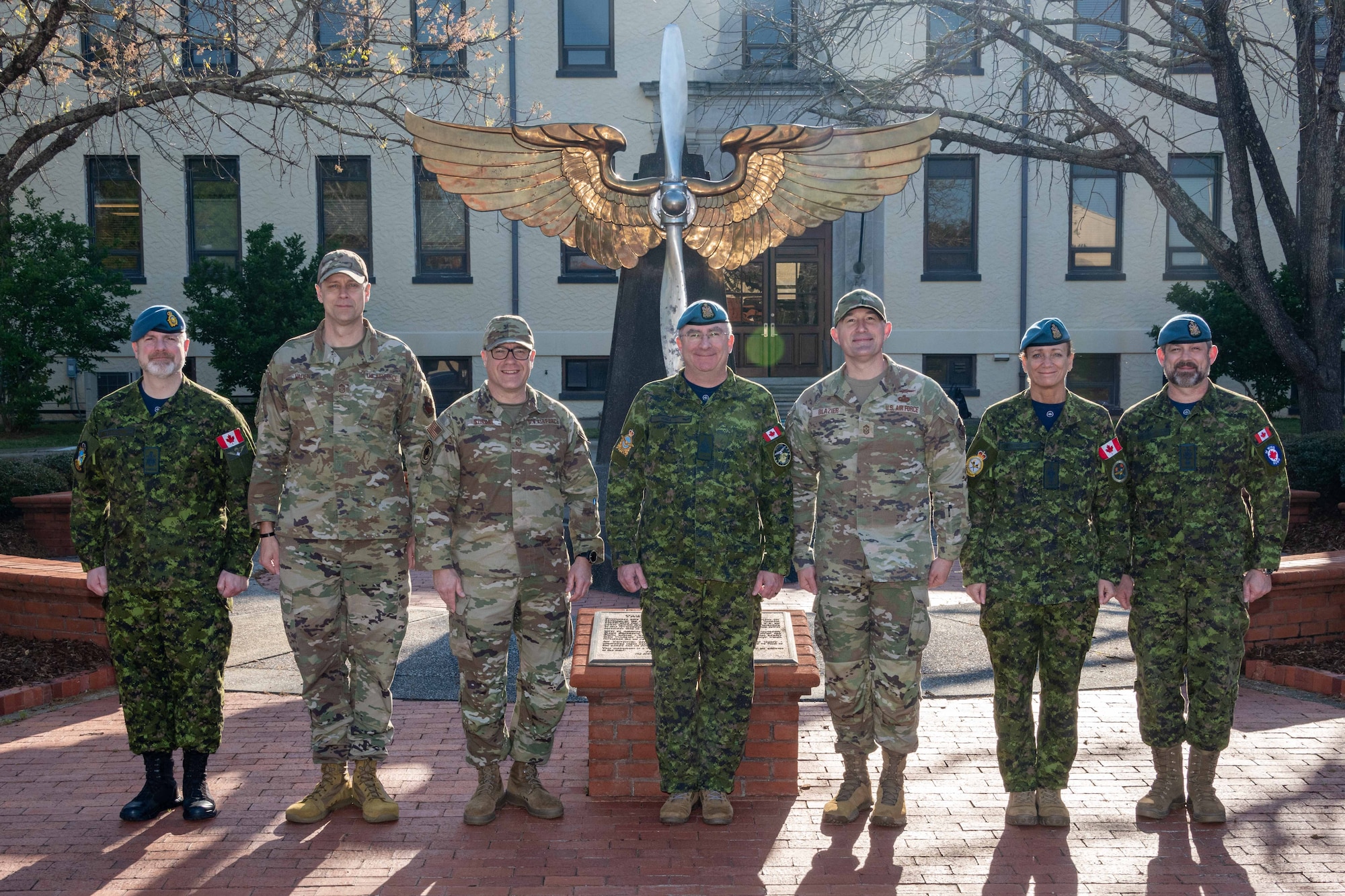 Royal Canadian Air Force Command Chief Warrant Officer John Hall (center) and RCAF representatives pose with Air University senior enlisted leaders at Maxwell Air Force Base, March 30, 2023. From left: Chief Warrant Officer Robert Peldjak, Chief Master Sgt. Richard Vaden, Chief Master Sgt. Mikael Sundin, CCWO Hall, and AU Command Chief Master Sgt. Stefan Blazier. (US Air Force photo by Melanie Rodgers Cox)