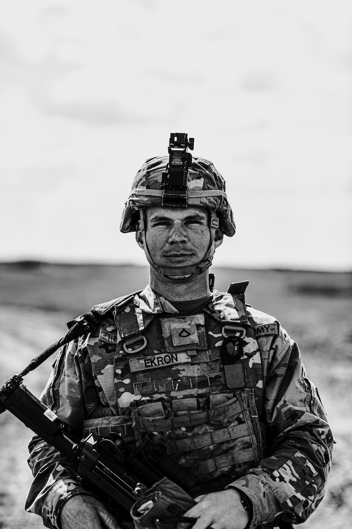 Private 1st. Class Dewald Ekron, Bravo Company, 1st Battalion, 179 Infantry Regiment, Oklahoma National Guard, stands before conducting actions on the objective during pre-moblization training at Ft. Riley, Kan., 25 March 2023. Ekron, a South Africa native, moved to the United States in 2017 to pursue farming. More than 1,000 Oklahoma Army National Guardsmen, including a company each from Nebraska and Indiana, will deploy overseas as Task Force Tomahawk in support of operations within U.S. Africa Command’s area of responsibility. While there, they will provide security support at five installations across multiple East African countries. (Oklahoma National Guard by Sgt. 1st Class Mireille Merilice-Roberts)