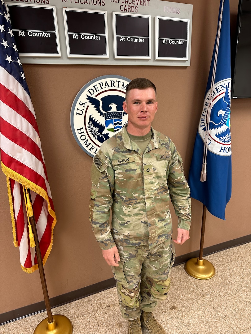 Private 1st. Class Dewald Ekron, Bravo Company,  1st Battalion, 179 Infantry Regiment, 45th Infantry Brigade Combat Team, Oklahoma National Guard, stands after passing his naturalization test April 9, 2023. Ekron, a South Africa native, moved to the United States in 2017 to pursue farming. More than 1,000 Oklahoma Army National Guardsmen, including a company each from Nebraska and Indiana, will deploy overseas as Task Force Tomahawk in support of operations within U.S. Africa Command’s area of responsibility. While there, they will provide security support at multiple  installations across multiple East African countries. (Oklahoma National Guard by Sgt. 1st Class Mireille Merilice-Roberts)