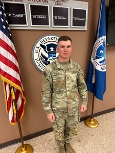 Private 1st. Class Dewald Ekron, Bravo Company,  1st Battalion, 179 Infantry Regiment, 45th Infantry Brigade Combat Team, Oklahoma National Guard, stands after passing his naturalization test April 9, 2023. Ekron, a South Africa native, moved to the United States in 2017 to pursue farming. More than 1,000 Oklahoma Army National Guardsmen, including a company each from Nebraska and Indiana, will deploy overseas as Task Force Tomahawk in support of operations within U.S. Africa Command’s area of responsibility. While there, they will provide security support at multiple  installations across multiple East African countries. (Oklahoma National Guard by Sgt. 1st Class Mireille Merilice-Roberts)