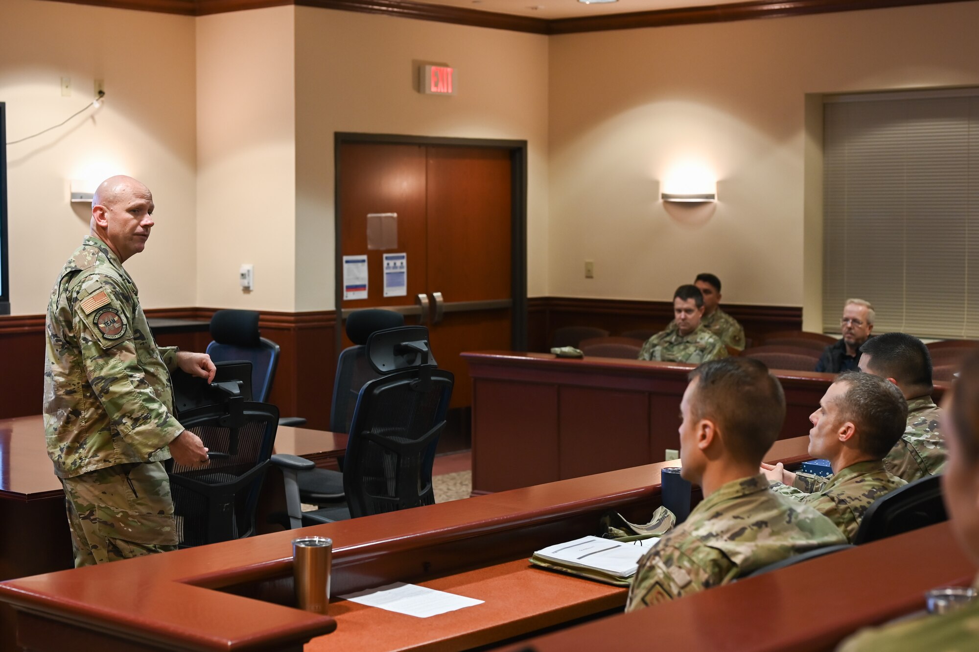 U.S. Air Force Col. Davidson, 47th Flying Training Wing commander, engages in discussion with his team members during a professional development session at Laughlin Air Force Base, Texas, on March 22, 2023. The team took advantage of the opportunity to discuss the concepts presented in the book "Thanks for the Feedback" and how they can apply them to their roles as leaders in the Air Force. (U.S. Air Force photo by Airman 1st Class Keira Rossman)