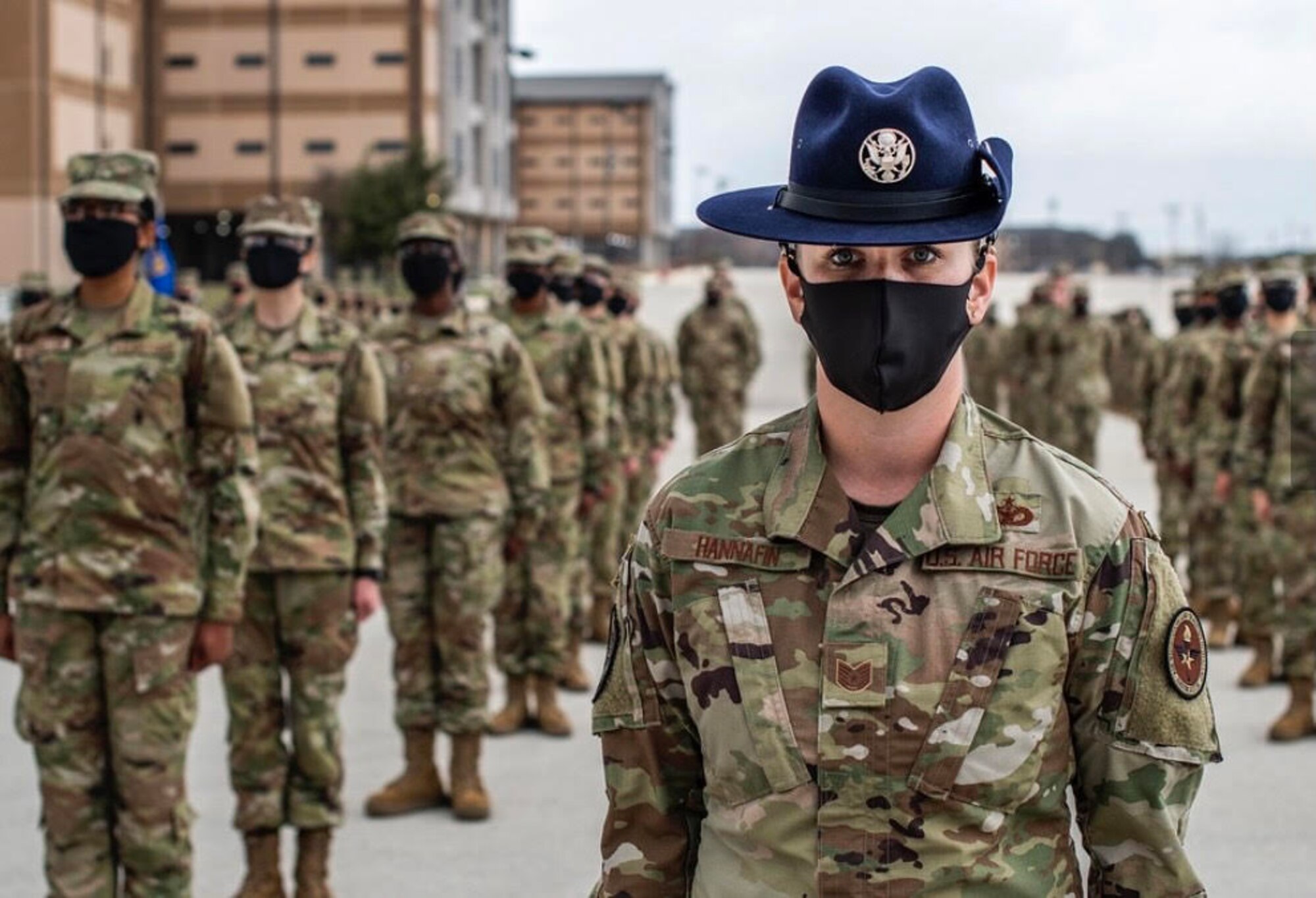 Drill instructor stands with flight at BMT.