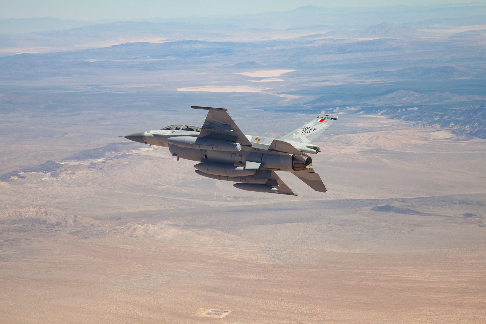 The first Royal Bahraini Air Force F-16 Block 70 flies in the skies above Southern California before landing at Edwards Air Force Base, California, March 28. The first-of-its-kind aircraft departed the Lockheed Martin facility in Greenville, South Carolina, before flying cross-country to Edwards AFB. (Photo courtesy of 412th Test Wing Public Affairs, US Air Force)
