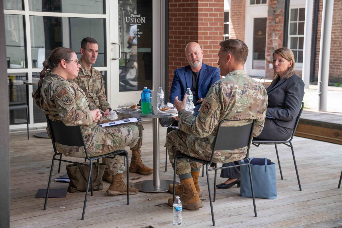 The judges deliberate to determine the winning pitched idea at the annual Spark at the Max on April 7, 2023. The Spark tank-style event invests in the innovative and problem-solving ideas of Airmen and Guardians to improve readiness, recover Airmen's time, save costs, and increase the force's lethality. (U.S. Air Force photo by Sean Ross)