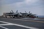 F/A-18E Super Hornets from the “Blue Diamonds” of Strike Fighter Squadron (VFA) 146 and the “Kestrels” of Strike Fighter Squadron (VFA) 137 prepare to launch from the aircraft carrier USS Nimitz (CVN 68).