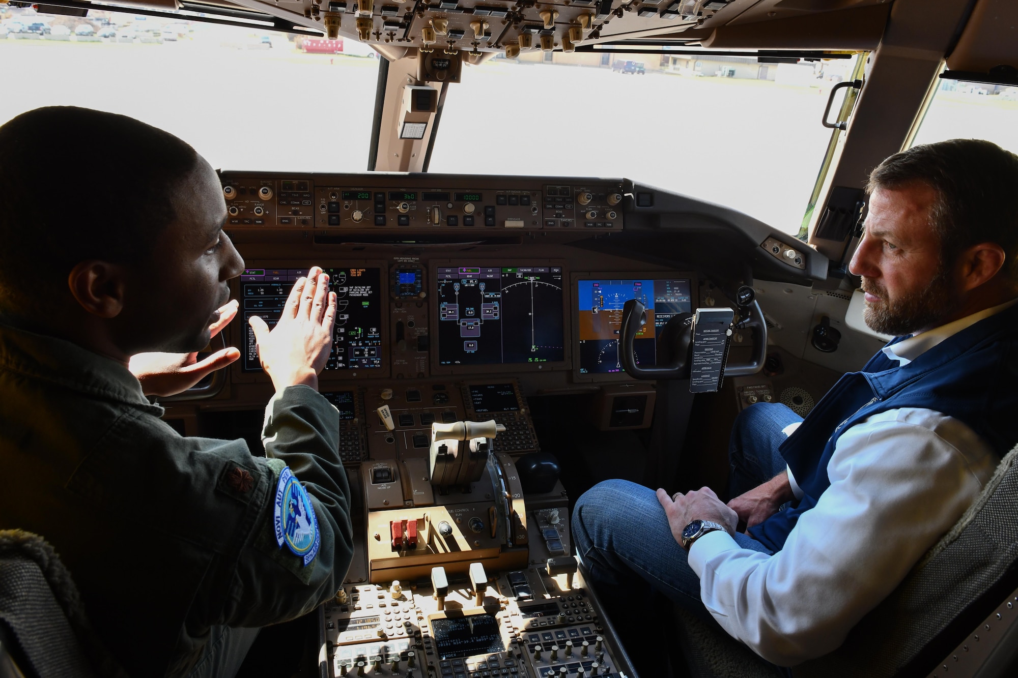 U.S. Air Force Maj. Ryan Smith, 56th Air Refueling Squadron instructor pilot, explains the mechanics of a KC-46 Pegasus to Markwayne Mullin, U.S. senator for Oklahoma, during a tour at Altus Air Force Base, Oklahoma, April 6, 2023. Sen. Mullin serves on the Airland, Emerging Threats and Capabilities, and the Readiness and Management Support committees in the U.S. Senate. (U.S. Air Force photo by Airman 1st Class Miyah Gray)