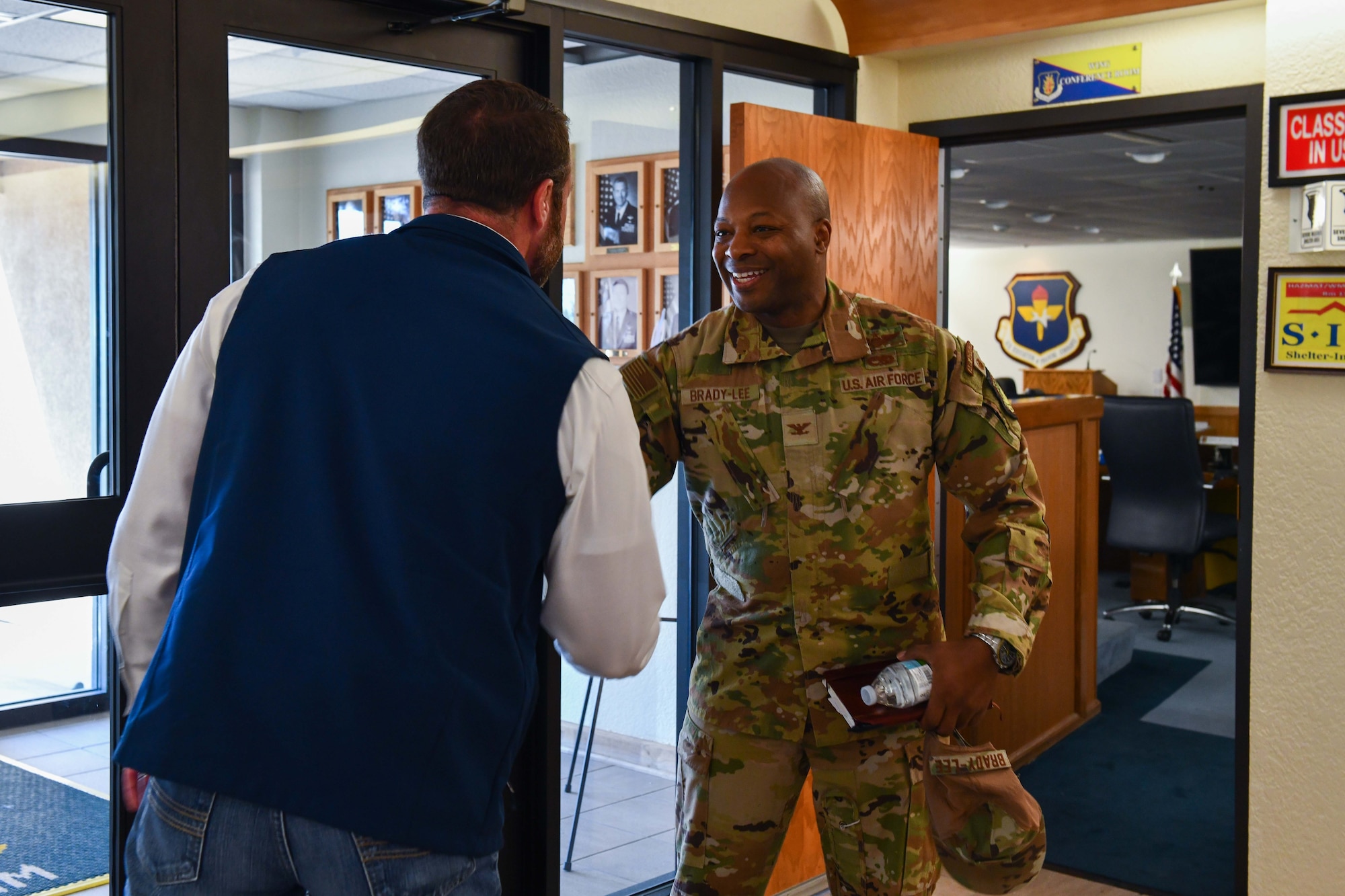 U.S. Air Force Col. Patrick Brady-Lee, 97th Air Mobility Wing vice commander, bids farewell to Markwayne Mullin, U.S. senator for Oklahoma, during a tour at Altus Air Force Base, Oklahoma, April 6, 2023. Sen. Mullin learned about the base’s mission and the challenges impacting the base and community. (U.S. Air Force photo by Airman 1st Class Miyah Gray)