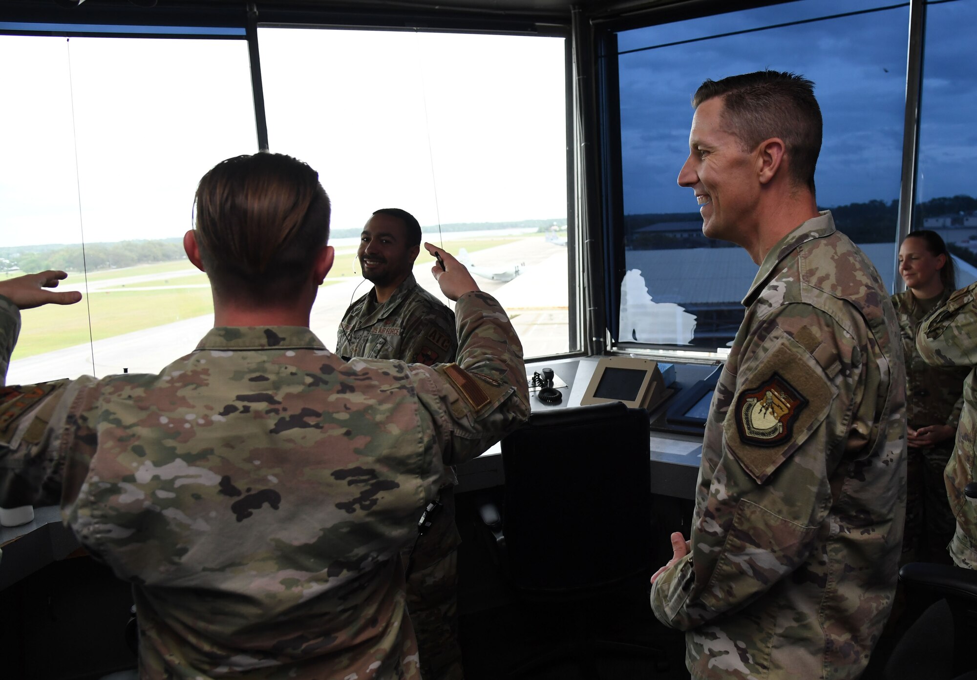 U.S. Air Force Tech. Sgt. Russell Osborne, 81st Operations Support Flight senior watch supervisor, briefs Col. Billy Pope, 81st Training Wing commander, on the air traffic control tower's mission and capabilities during the Wing Staff Agencies Immersion Tour inside at Keesler Air Force Base, Mississippi, April 11, 2023.