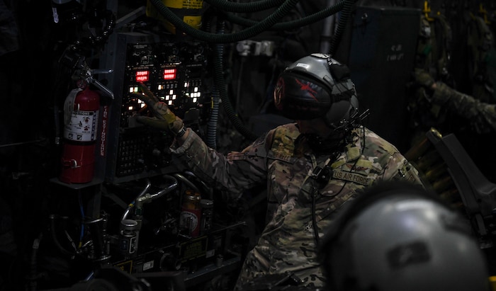 An AC-130U special missions aviator and evaluator with the 4th Special Operations Squadron, talks to the aircraft pilot during a live-fire training flight July 18, 2018, at Hurlburt Field, Fla. Thanks to an AC-130U crew, Tech. Sgt. Cam Kelsch, a Special Tactics tactical air control party operator with the 17th Special Tactics Squadron, was able to risk his life to save the life of his fellow teammate during a firefight in Afghanistan in 2018. (U.S. Air Force photo by Staff Sgt. Ryan Conroy)