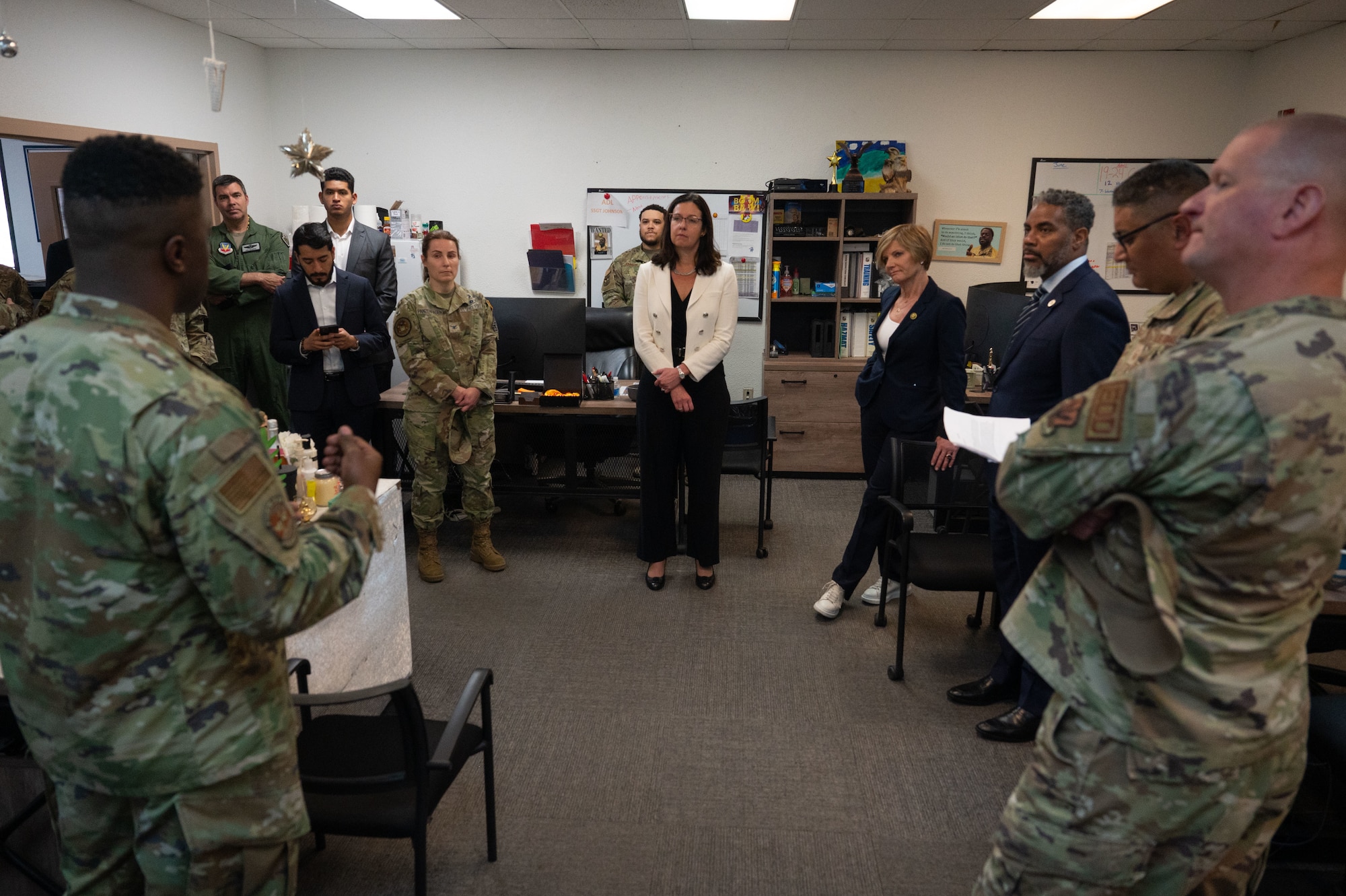 U.S. Air Force Staff. Sgt. Aaron Coles, 99th Civil Engineer Squadron Airmen dorm leader (ADL), briefs the Hon. Kristyn Jones, assistant secretary of the Air Force for Financial Management and Comptroller, performing the duties of under secretary of the Air Force, distinguished guests and base leadership on the duties ADLs perform to enhance Airmen’s living conditions at Nellis Air Force Base, April 7, 2023.