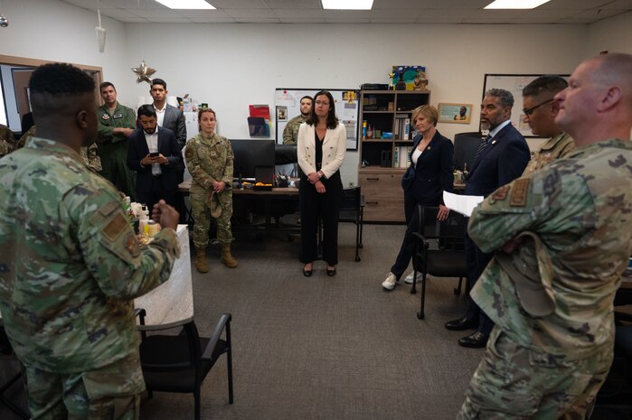 U.S. Air Force Staff. Sgt. Aaron Coles, 99th Civil Engineer Squadron Airmen dorm leader (ADL), briefs the Hon. Kristyn Jones, assistant secretary of the Air Force for Financial Management and Comptroller, performing the duties of under secretary of the Air Force, distinguished guests and base leadership on the duties ADLs perform to enhance Airmen’s living conditions at Nellis Air Force Base, April 7, 2023.