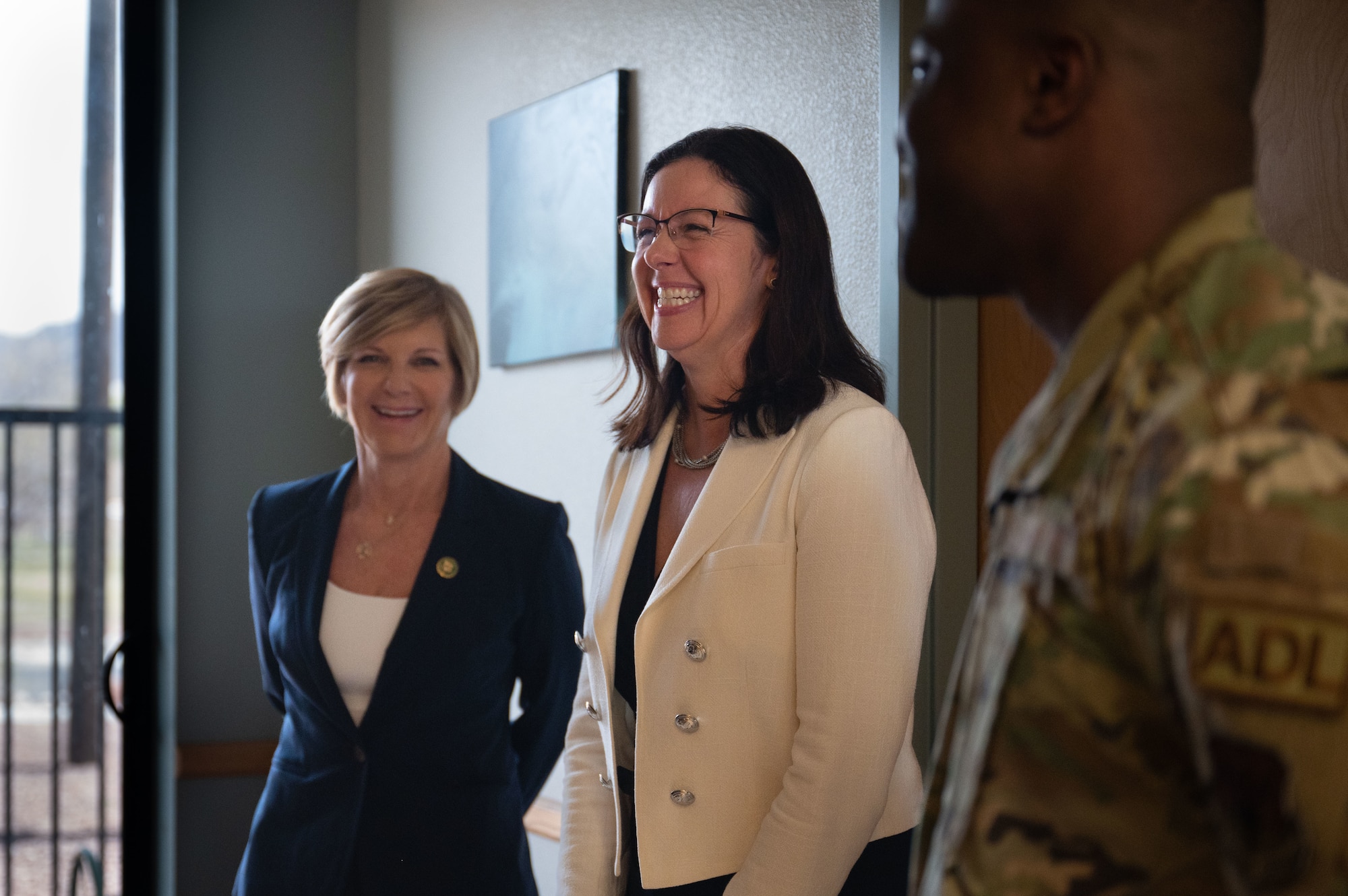 Congresswoman Susie Lee, left, the Hon. Kristyn Jones, assistant secretary of the Air Force for Financial Management and Comptroller, performing the duties of under secretary of the Air Force and Staff. Sgt. Aaron Coles, 99th Civil Engineer Squadron Airmen dorm leader, tour a dormitory at Nellis Air Force Base, April 7, 2023.