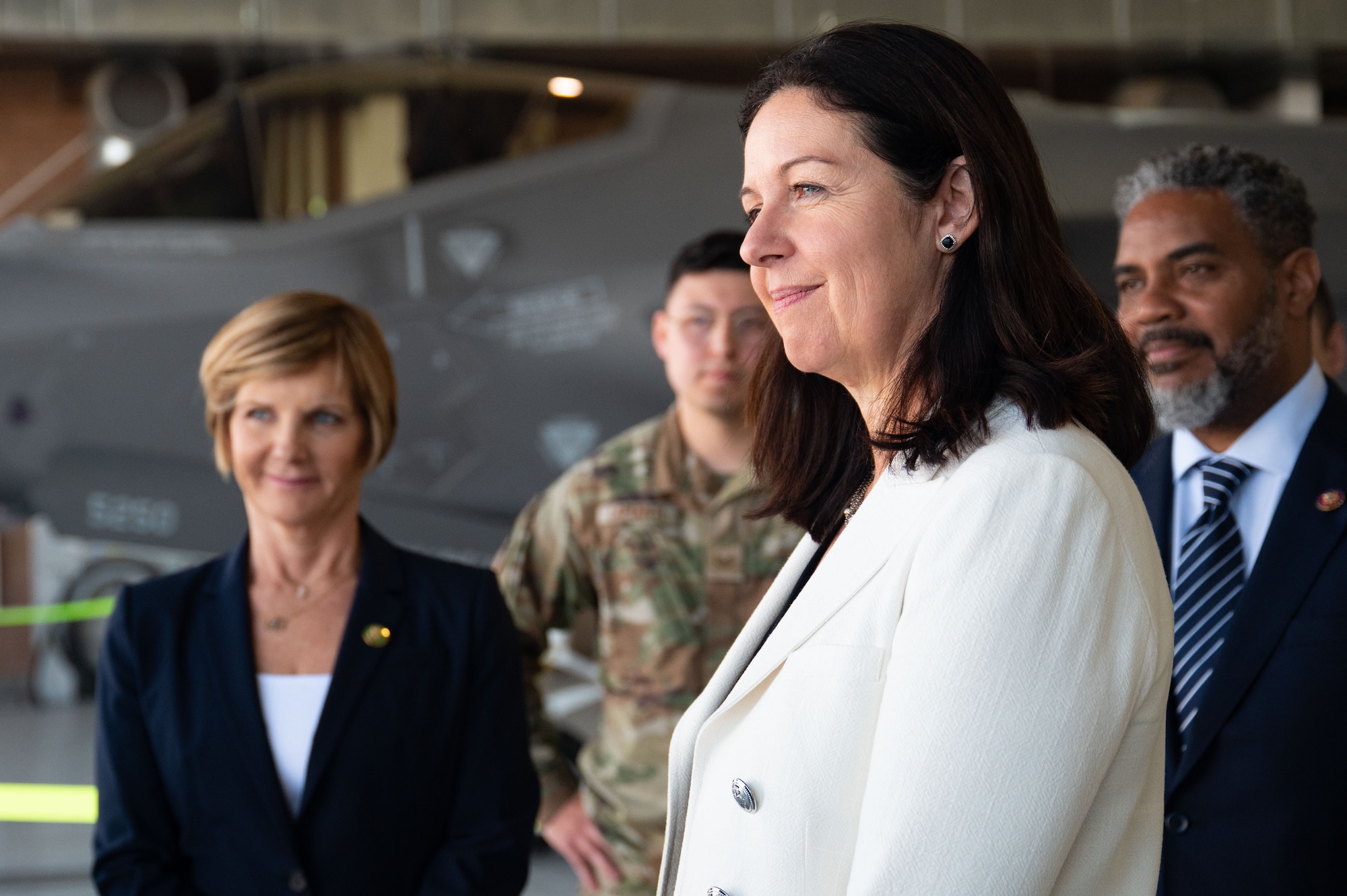 Congresswoman Susie Lee, left, the Hon. Kristyn Jones, assistant secretary of the Air Force for Financial Management and Comptroller, performing the duties of under secretary of the Air Force and Congressman Steven Horsford listen to Airmen from the 57th Aircraft Maintenance Squadron describe the capabilities of the F-35 Lighting II at Nellis Air Force Base, April 7, 2023.