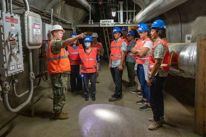 Defense Logistics Agency Energy East-Pacific Commander, U.S. Navy Cmdr. William Jakubowicz, guides the House Special Committee to Red Hill (HSCRH) during a tour of the Red Hill Bulk Fuel Storage Facility in Halawa, Hawaii, Apr. 12, 2023.