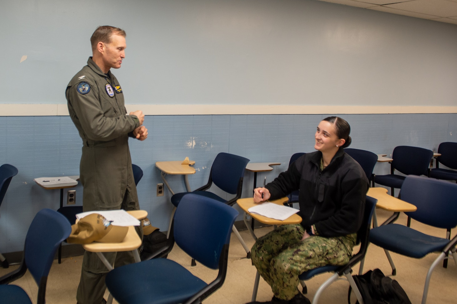 U.S. Navy Capt. Cassidy Norman, commanding officer of the Nimitz-class aircraft carrier USS John C. Stennis (CVN 74), interacts with Aviation Boatswain’s Mate (Equipment) Airman Titatianna Bennett, from Sarasota, Florida, during a School of Ship a visit at Huntington Hall, Hampton Virginia, Feb. 14, 2023. The John C. Stennis is in Newport News Shipyard conducting Refueling and Complex Overhaul to prepare the ship for the second half of its 50-year service life.