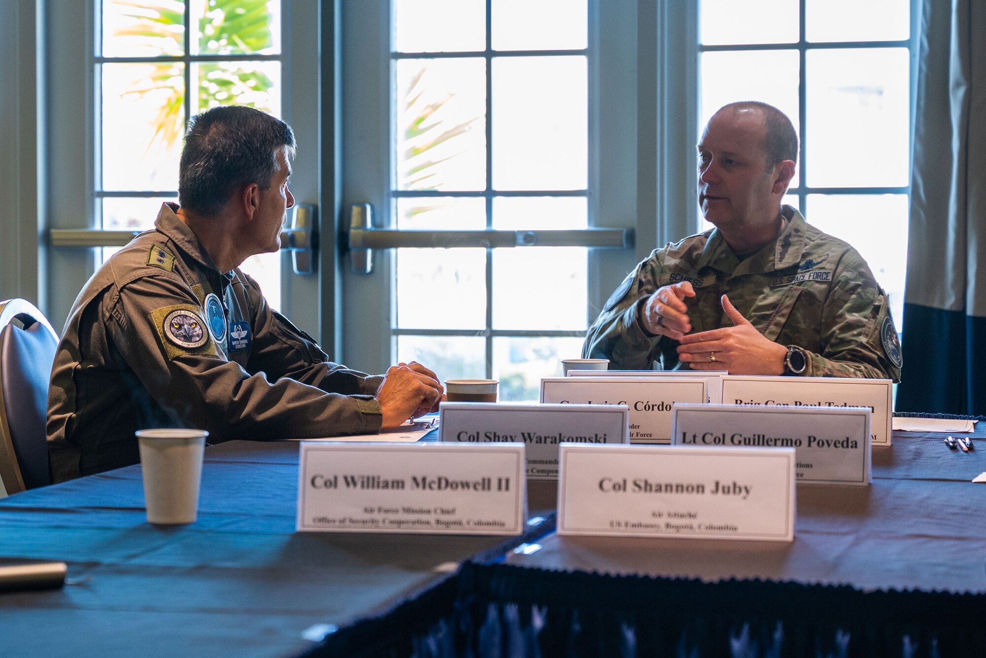Gen. Luis Carlos Córdoba Avendaño, Colombian Air Force (COLAF) commander, left, talks with U.S. Space Force Maj. Gen. Douglas A. Schiess, Combined Force Space Component Command commander, during an office call at Vandenberg Space Force Base, Calif., April 10, 2023. Córdoba led a delegation of industry and academia representatives to witness the launch of COLAF's second nanosatellite in partnership with EXOLAUNCH and SpaceX. The visit also included an in-depth pad tour of SpaceX's Space Launch Complex-4 and a sit-down meeting with Schiess to discuss on-going space cooperation efforts. (U.S. Space Force photo by Tech. Sgt. Luke Kitterman)