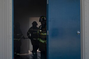 Dallas Fort Worth firefighters conduct a live fire training drill at a fire training site in Abilene, Texas, April 10, 2023. Firefighters from the 7th Civil Engineering Squadron trained with Dallas Fort Worth and Abilene firefighters to educate them on effectively using Ultra High-Pressure systems to extinguish fires in minimal time. The training was held to not only educate civilian firefighters on Ultra High-Pressure systems but also to strengthen the partnership with local and state fire departments. (U.S. Air Force photo by Airman Emma Anderson)