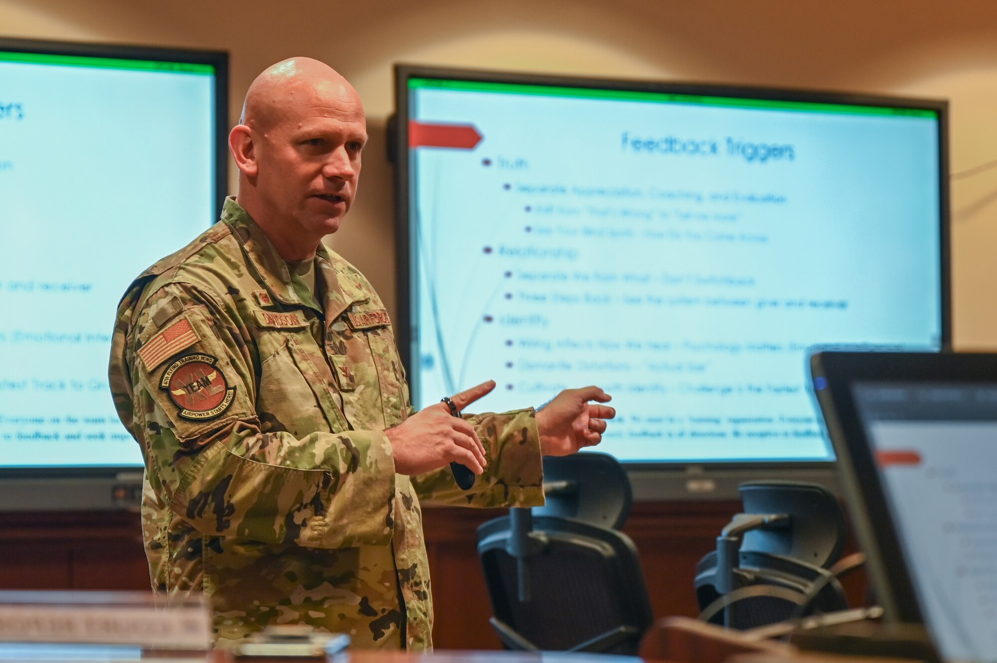 U.S. Air Force Col. Davidson, 47th Flying Training Wing commander, discusses feedback with his commanders during a professional development session at Laughlin Air Force Base, Texas, on March 22, 2023. The group explored the concepts outlined in the book "Thanks for the Feedback" and how they apply to the Air Force's core values of integrity, service, and excellence. (U.S. Air Force photo by Airman 1st Class Keira Rossman)