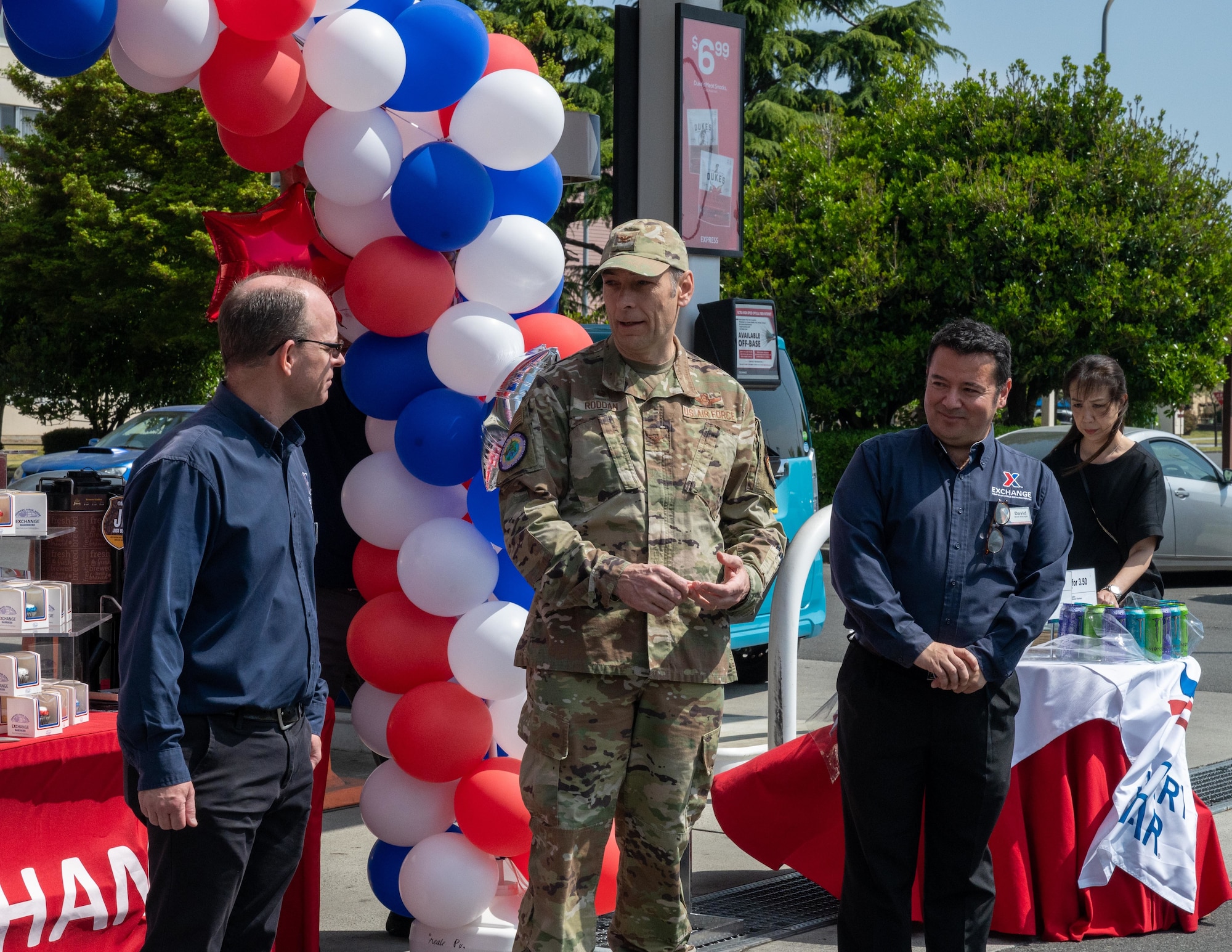 Colonel Roddan and AAFES employees speak at the ribbon cutting.