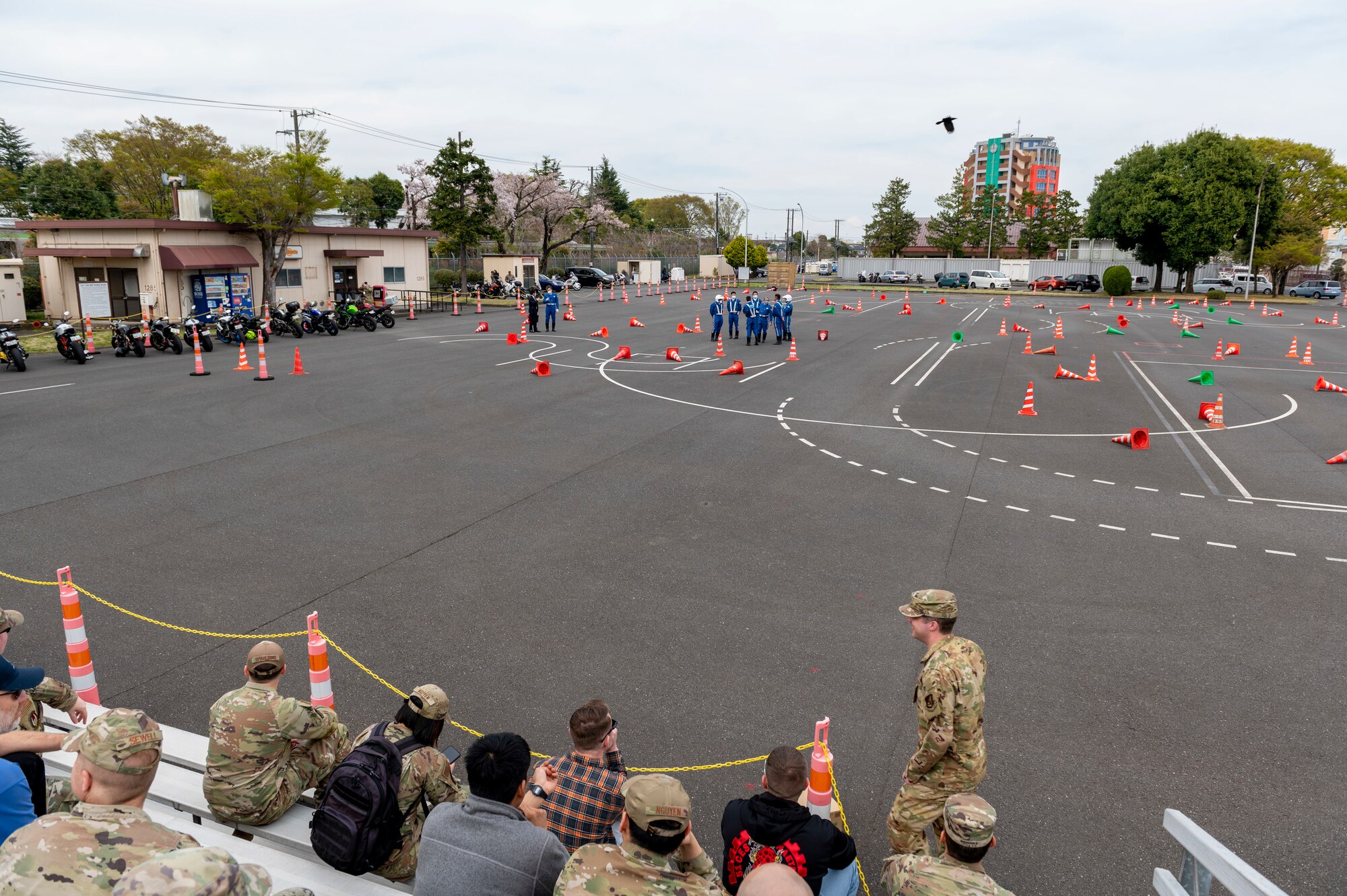 a high and wide view of a large parking lot dotted with traffic cones