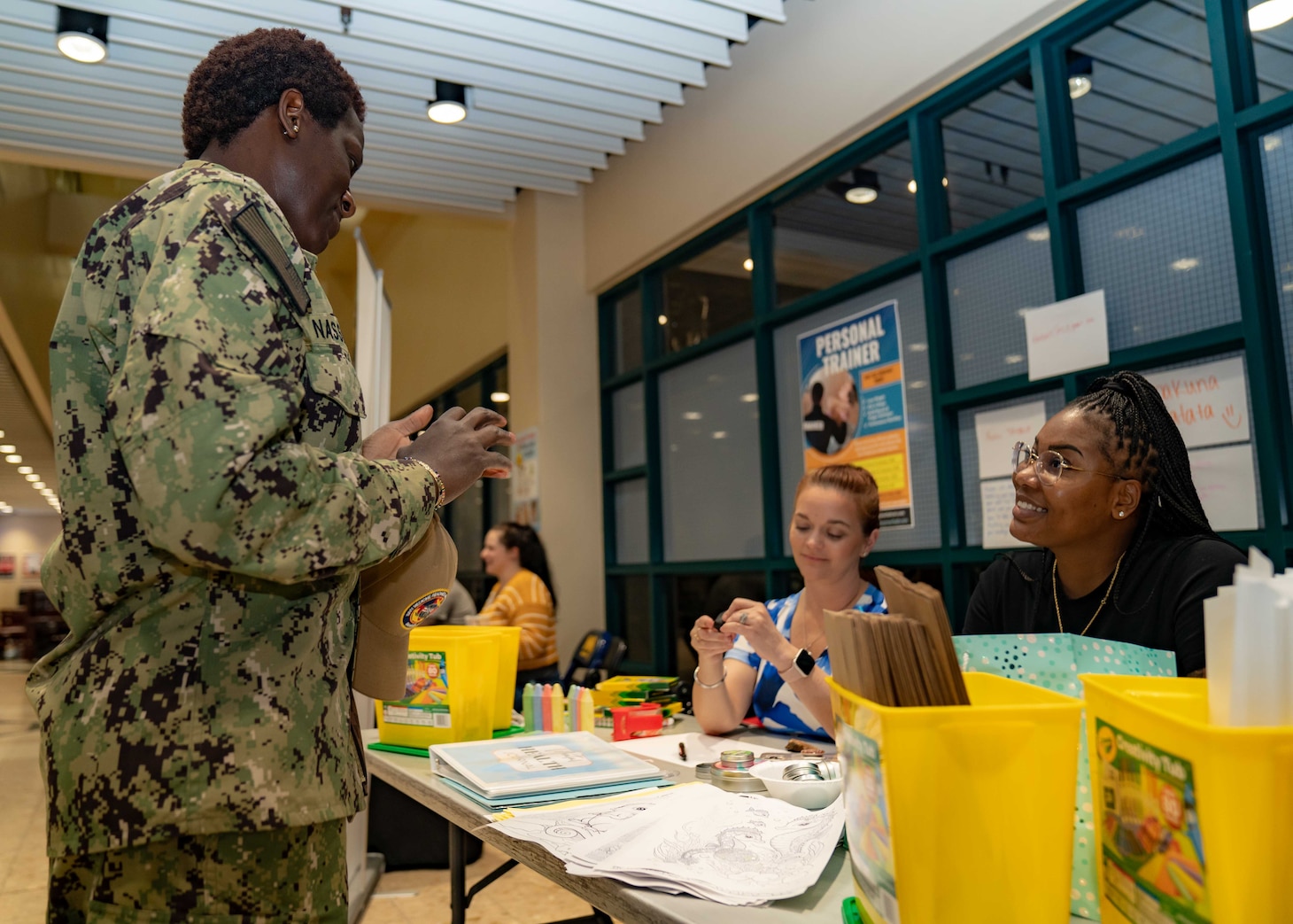 230412-A-NR779-2007 MANAMA, Bahrain (April 12, 2023) Members assigned to U.S. Naval Forces Central Command talk to a Sailor during a mental health awareness event in Bahrain, April 12, 2023.