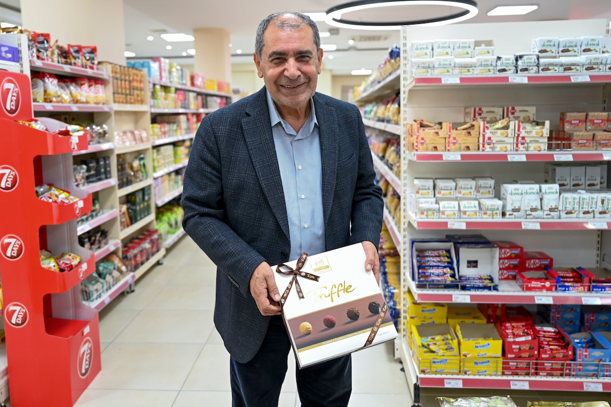 Mehmet Birbiri, 39th Air Base Wing Public Affairs host nation advisor, showcases gifts that are commonly given during the 3 ½-day Sugar Festival at Incirlik Air Base, Türkiye, April 13, 2023.