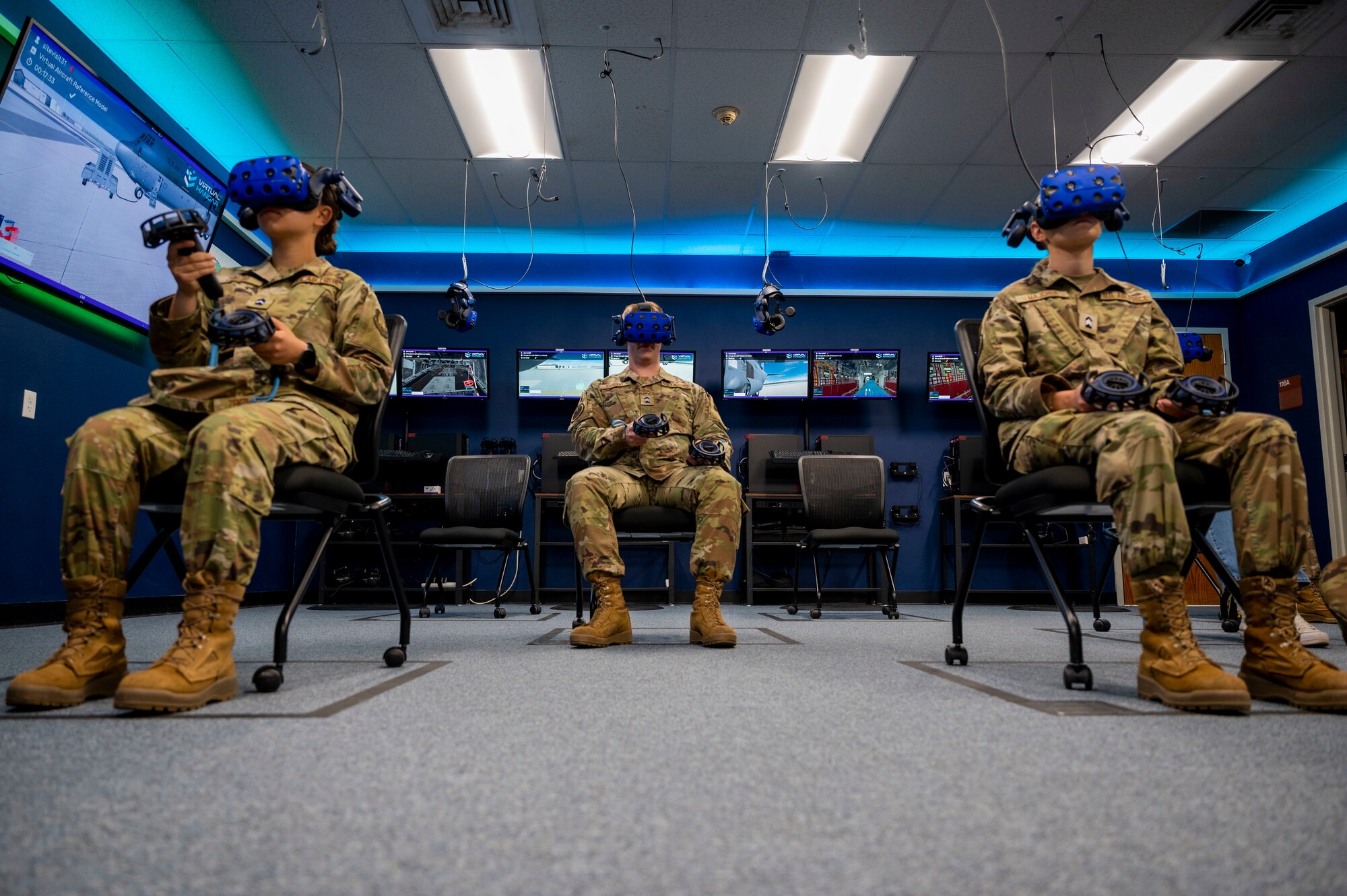 Students from three Texas universities use virtual reality equipment while on a tour at Dyess Air Force Base.